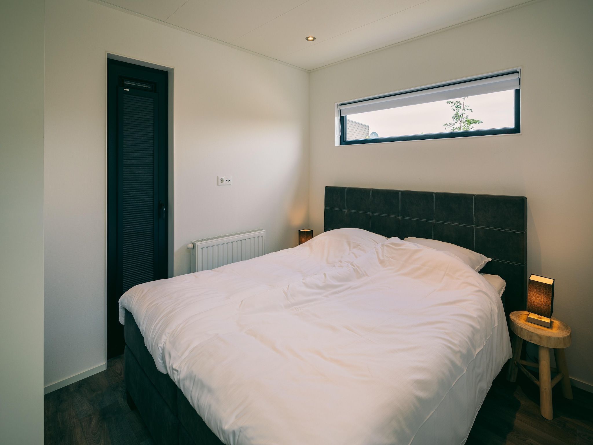 Een slaapkamer van Vakantiepark Zeedijk 2 in Herkingen