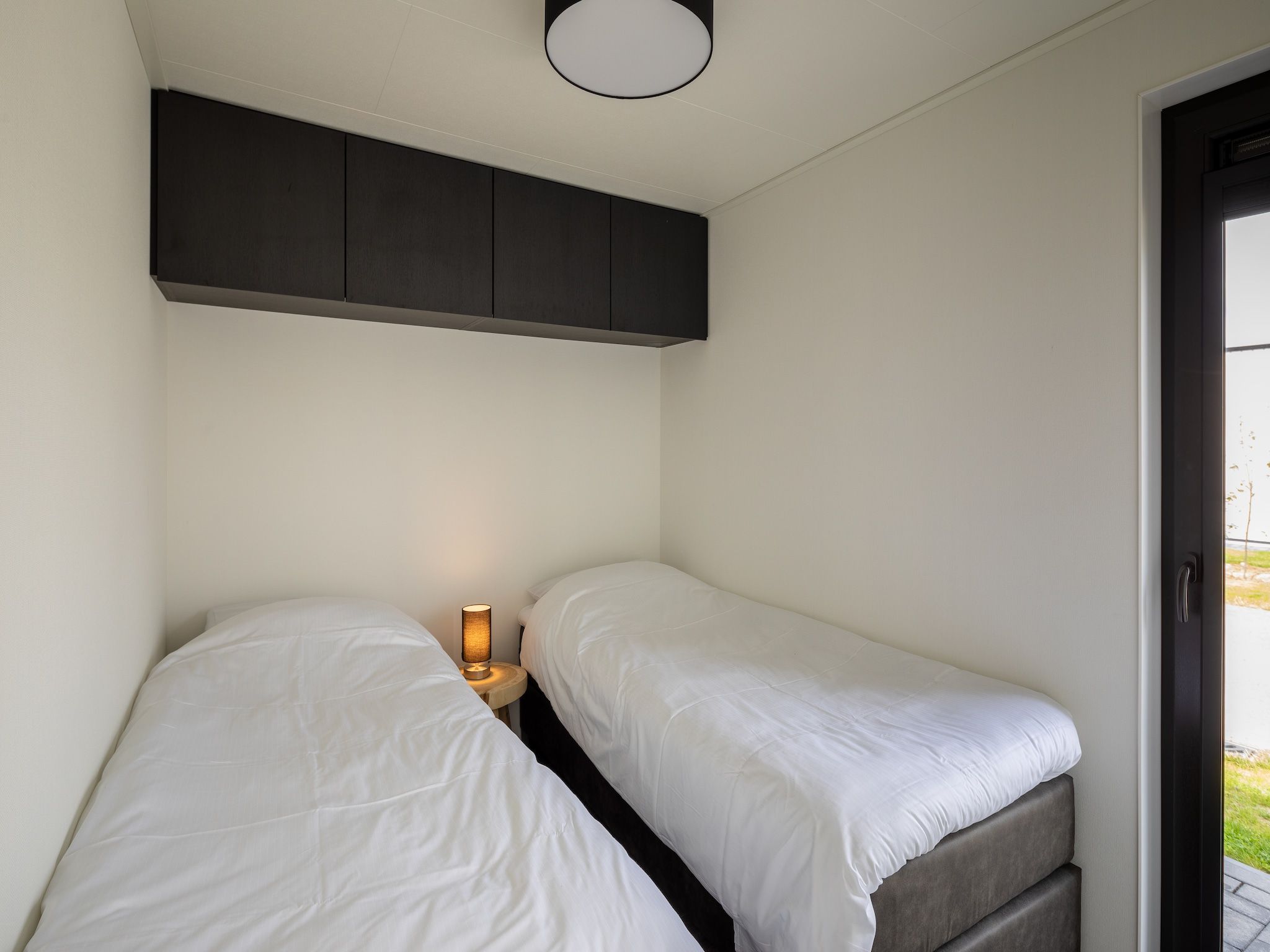 Een slaapkamer van Vakantiepark Zeedijk 3 in Herkingen