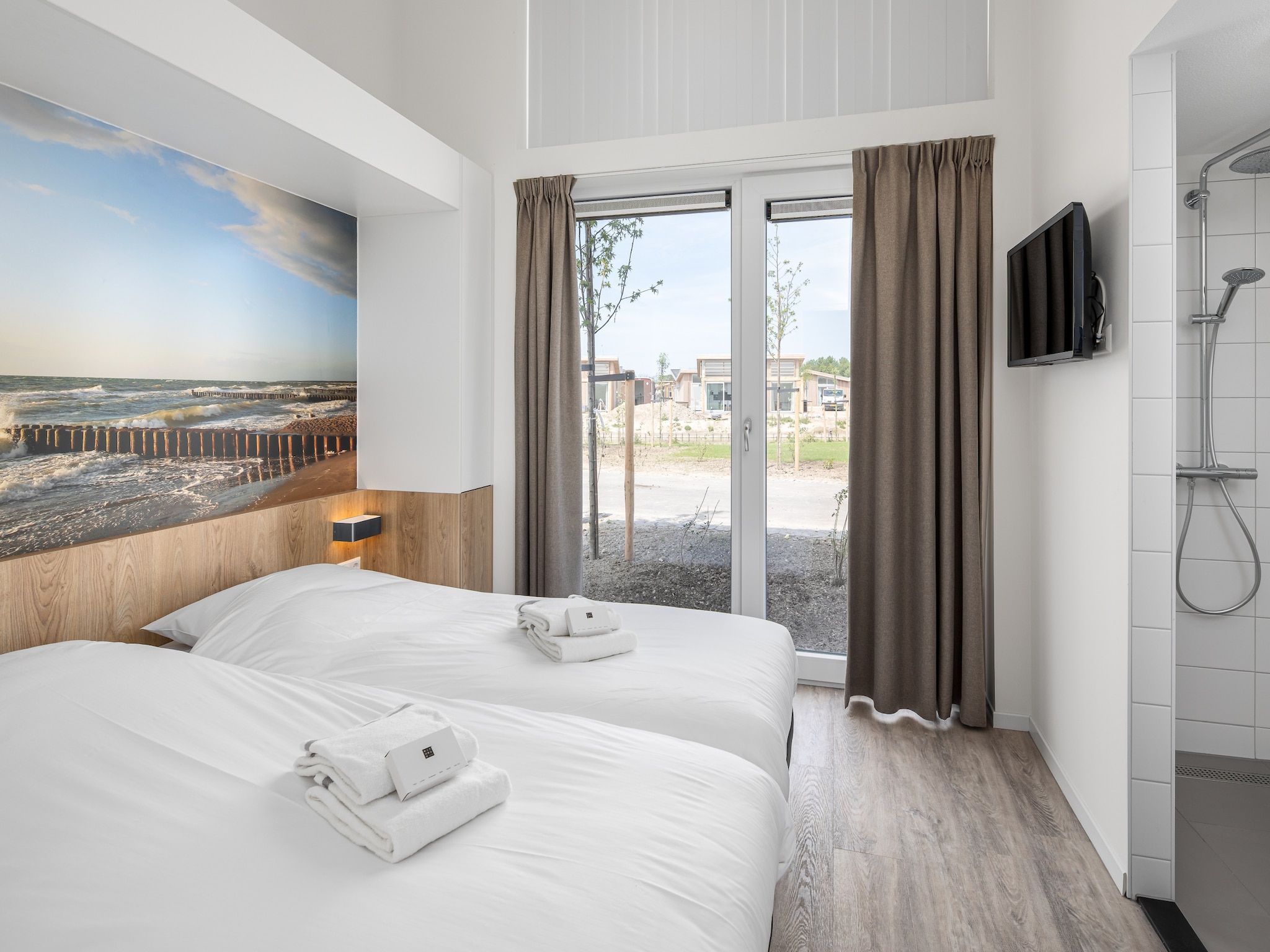 Een slaapkamer van Water Village 2 in Kamperland