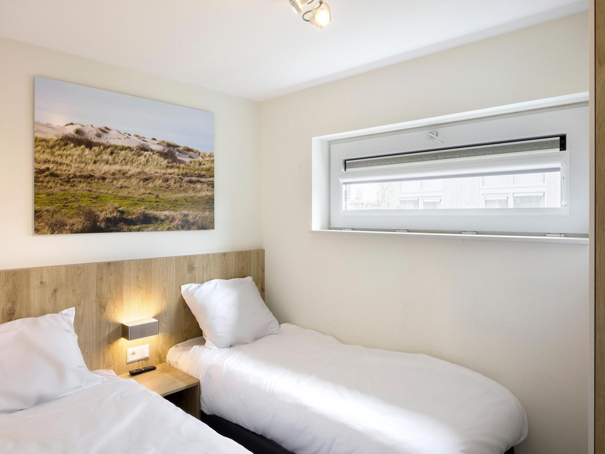 Een slaapkamer van Water Village 3 in Kamperland