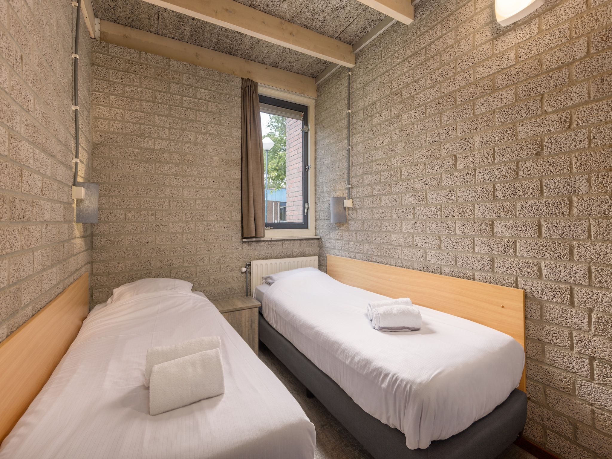 Een slaapkamer van Vakantiepark Weerterbergen 9 in Weert