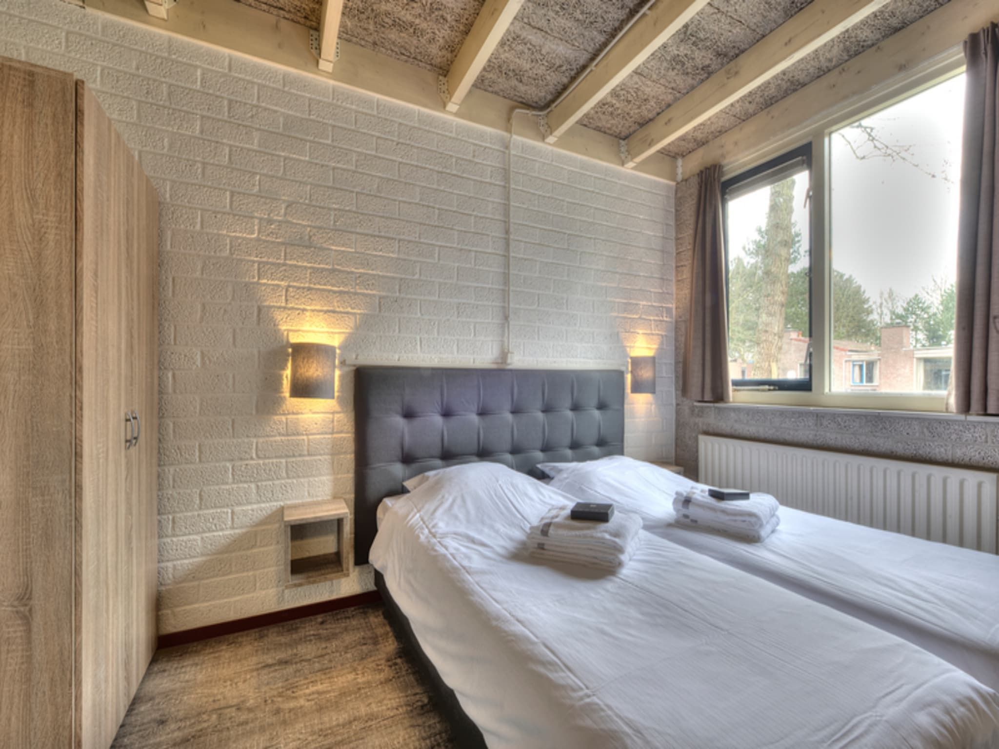 Een slaapkamer van Vakantiepark Weerterbergen 10 in Weert