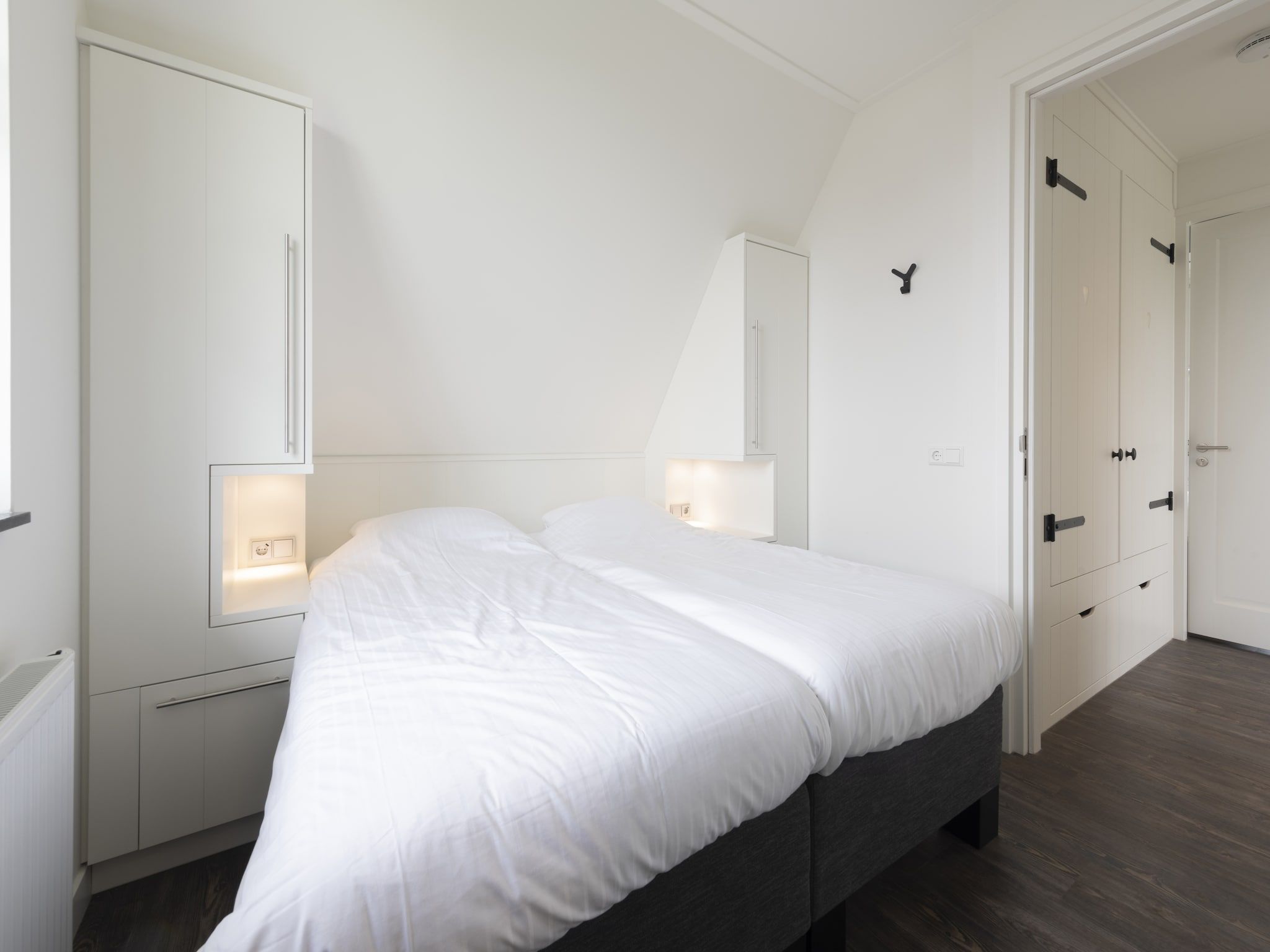 Een slaapkamer van Friese Meren Villa's 2 in Delfstrahuizen