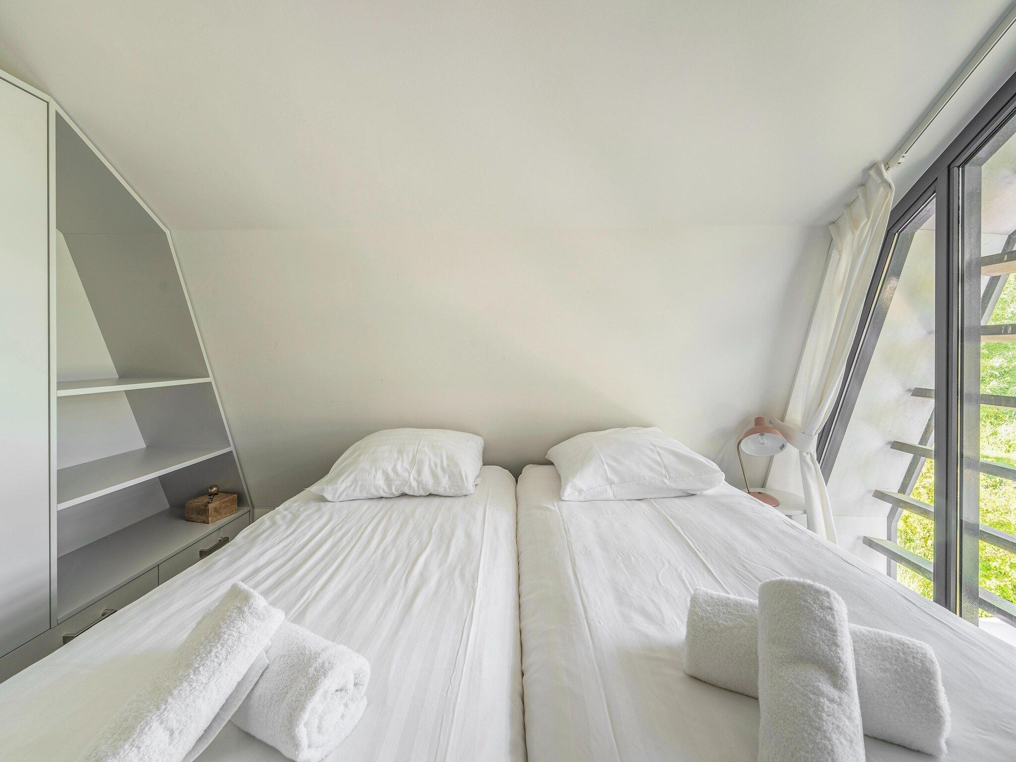 Een slaapkamer van Duinvilla aan het Meer in Egmond aan den Hoef