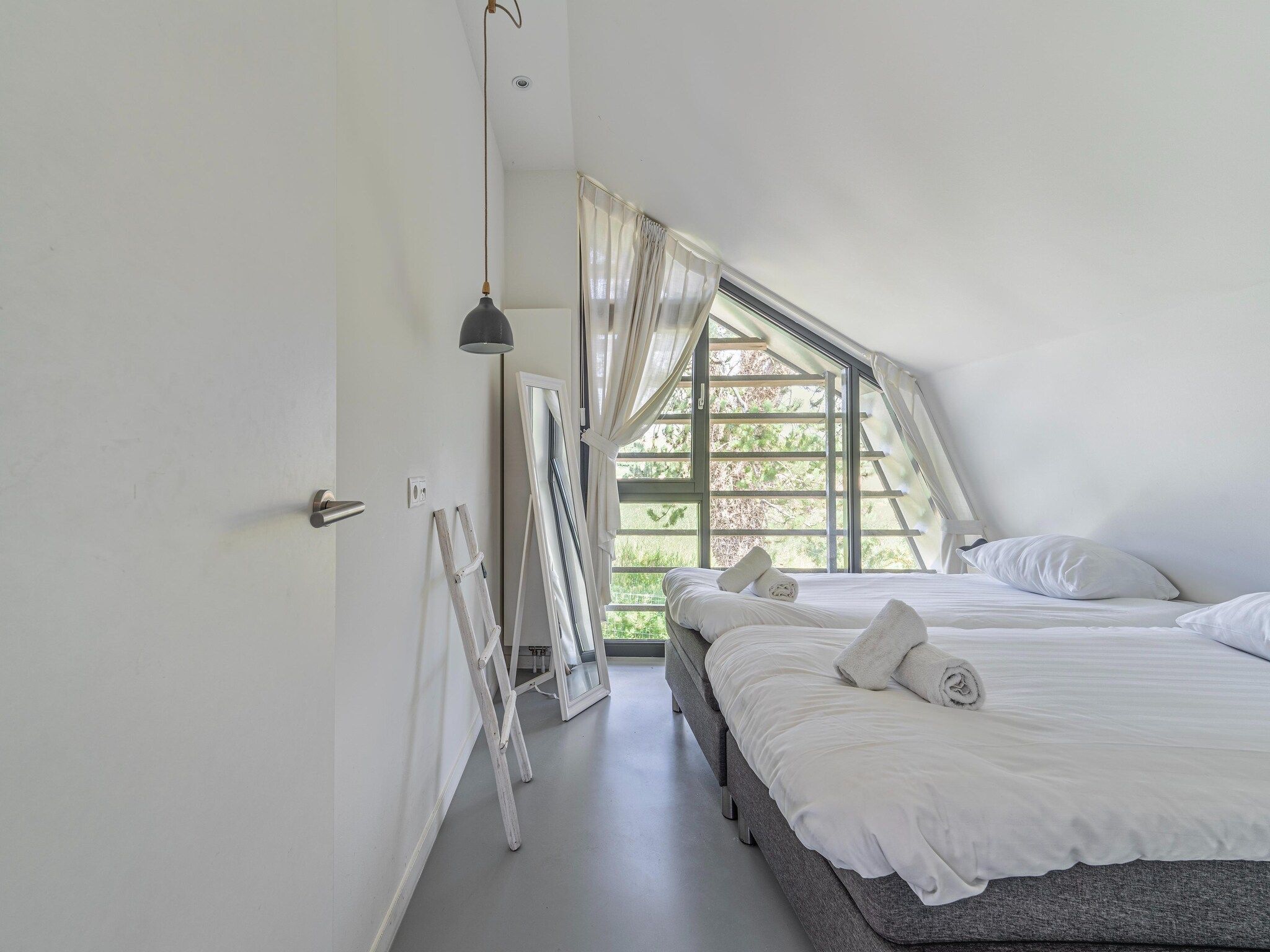 Een slaapkamer van Duinvilla aan het Meer in Egmond aan den Hoef