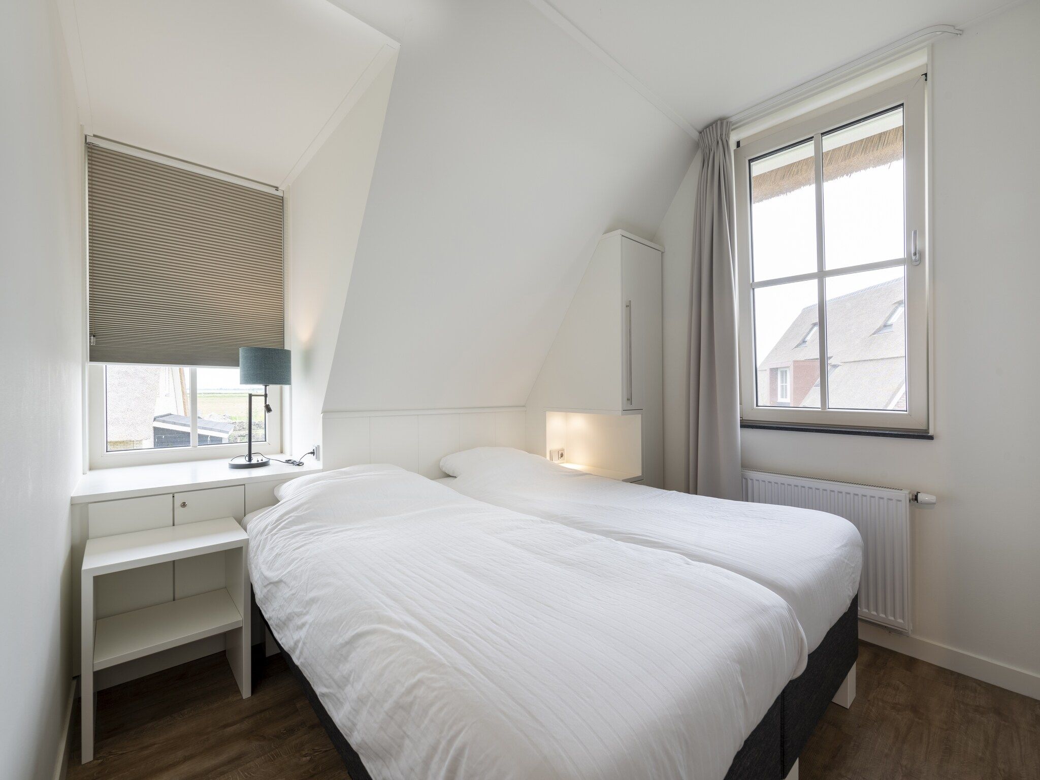 Een slaapkamer van Friese Meren Villa's 5 in Delfstrahuizen