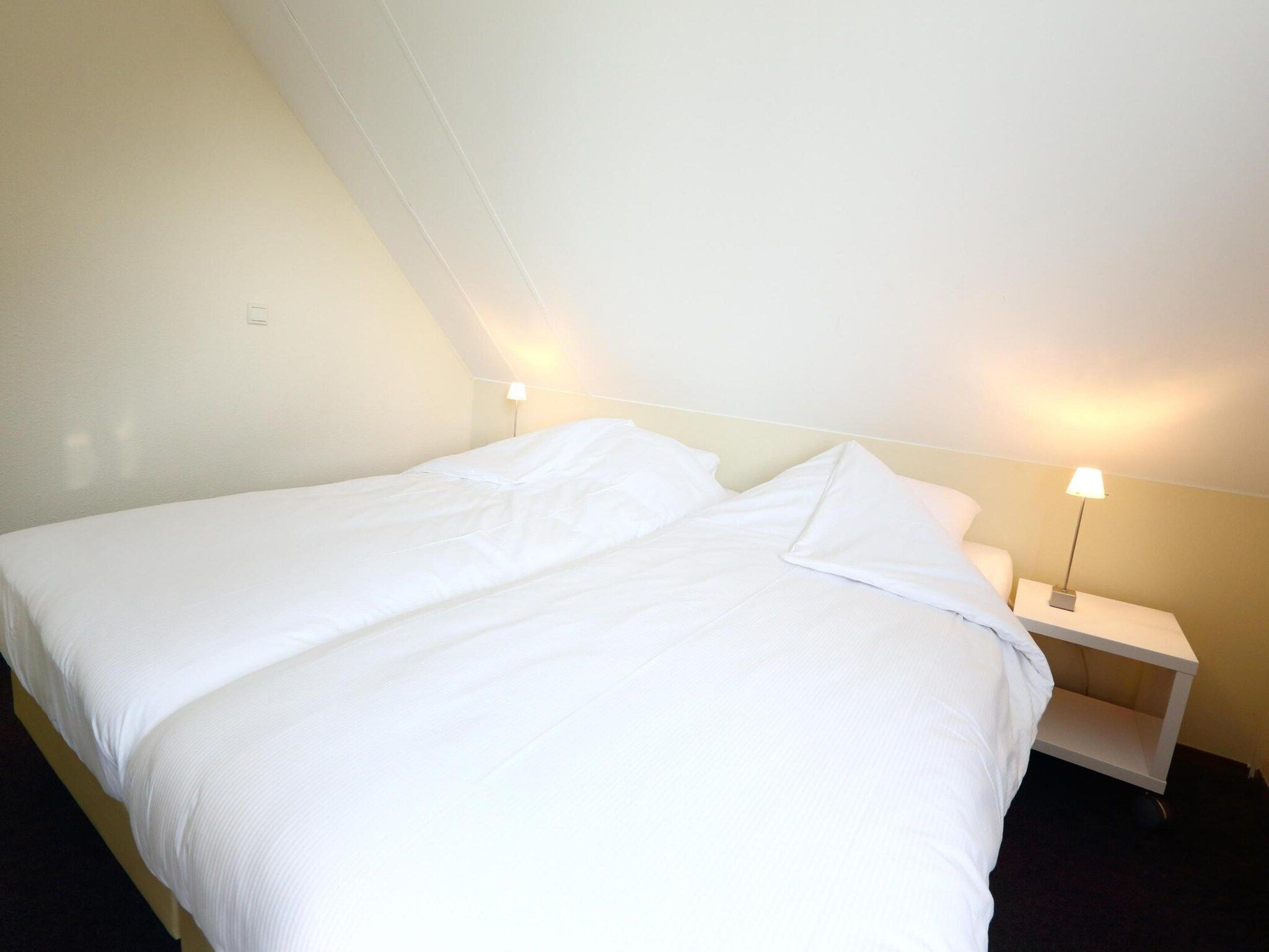 Een slaapkamer van Vakantiepark Emslandermeer 1 in Vlagtwedde