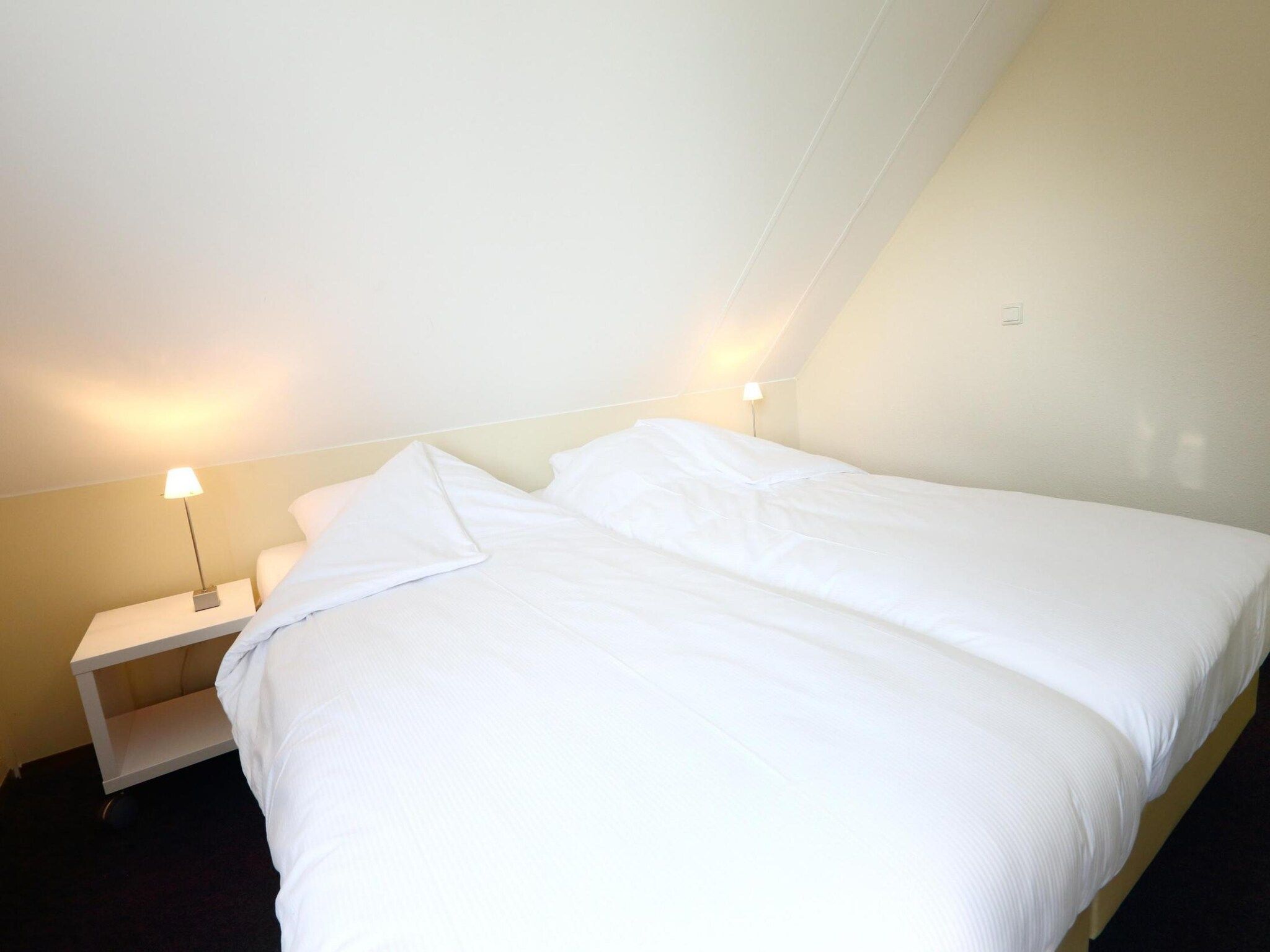 Een slaapkamer van Vakantiepark Emslandermeer 1 in Vlagtwedde