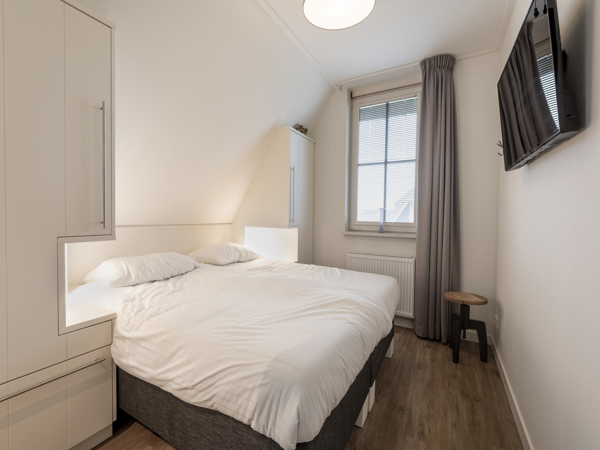 Een slaapkamer van Friese Meren Villa's 7 in Delfstrahuizen