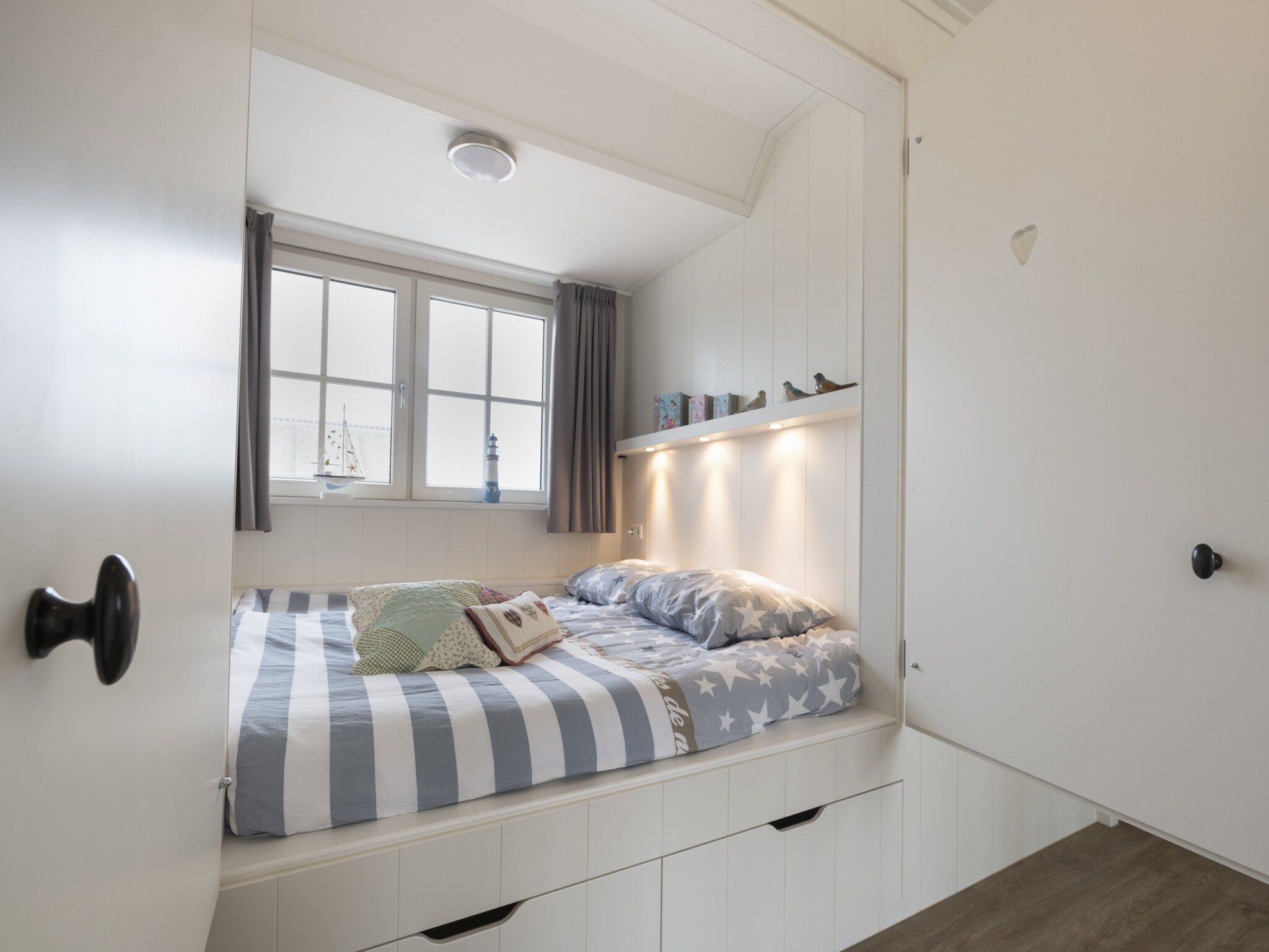 Een slaapkamer van Friese Meren Villa's 7 in Delfstrahuizen