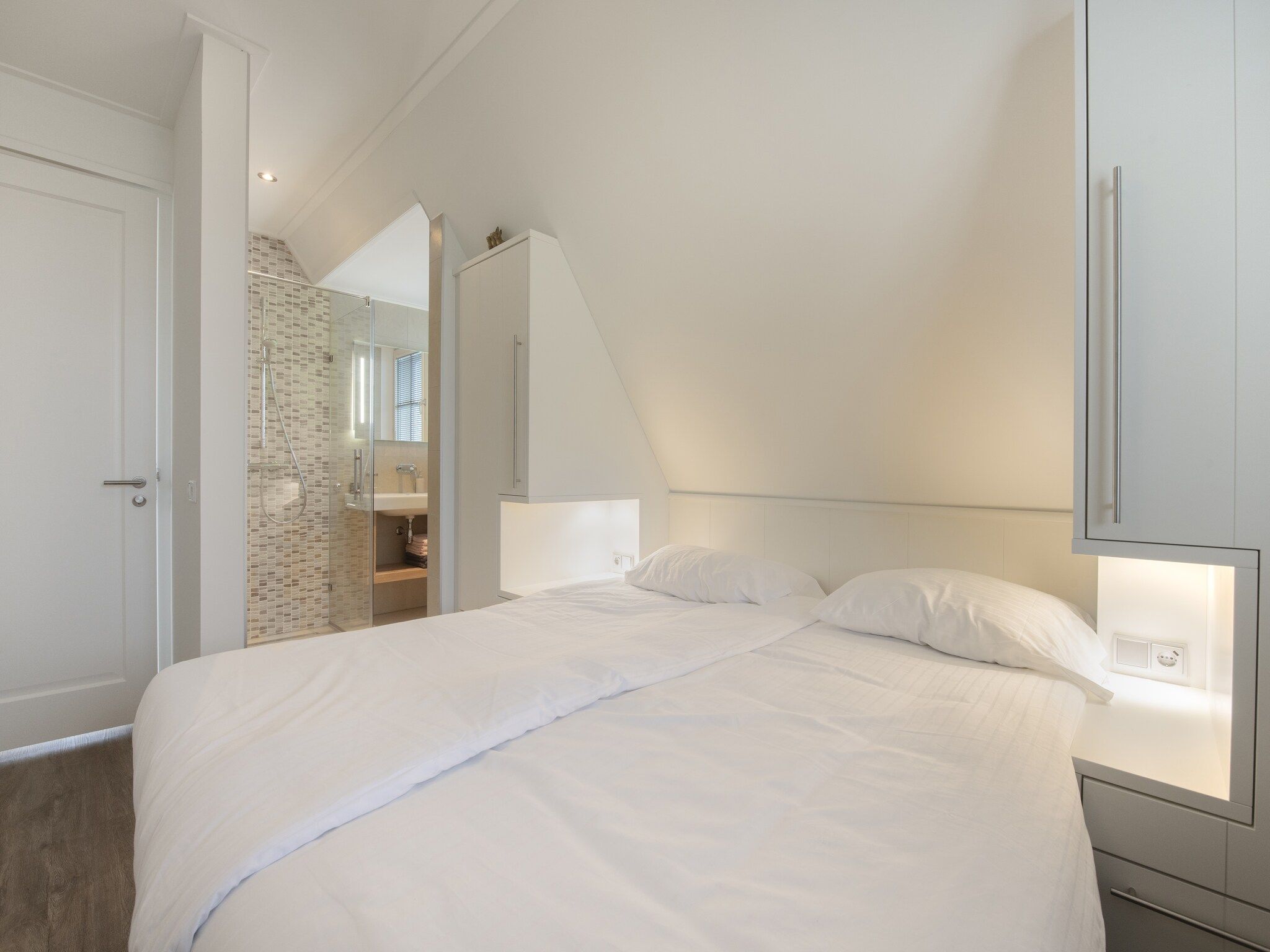 Een slaapkamer van Friese Meren Villa's 7 in Delfstrahuizen