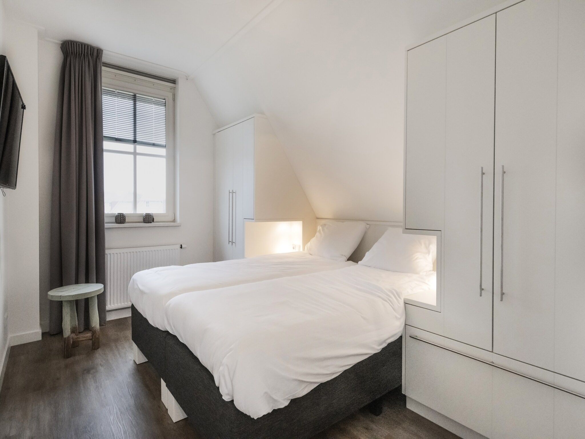 Een slaapkamer van Friese Meren Villa's 7 in Delfstrahuizen