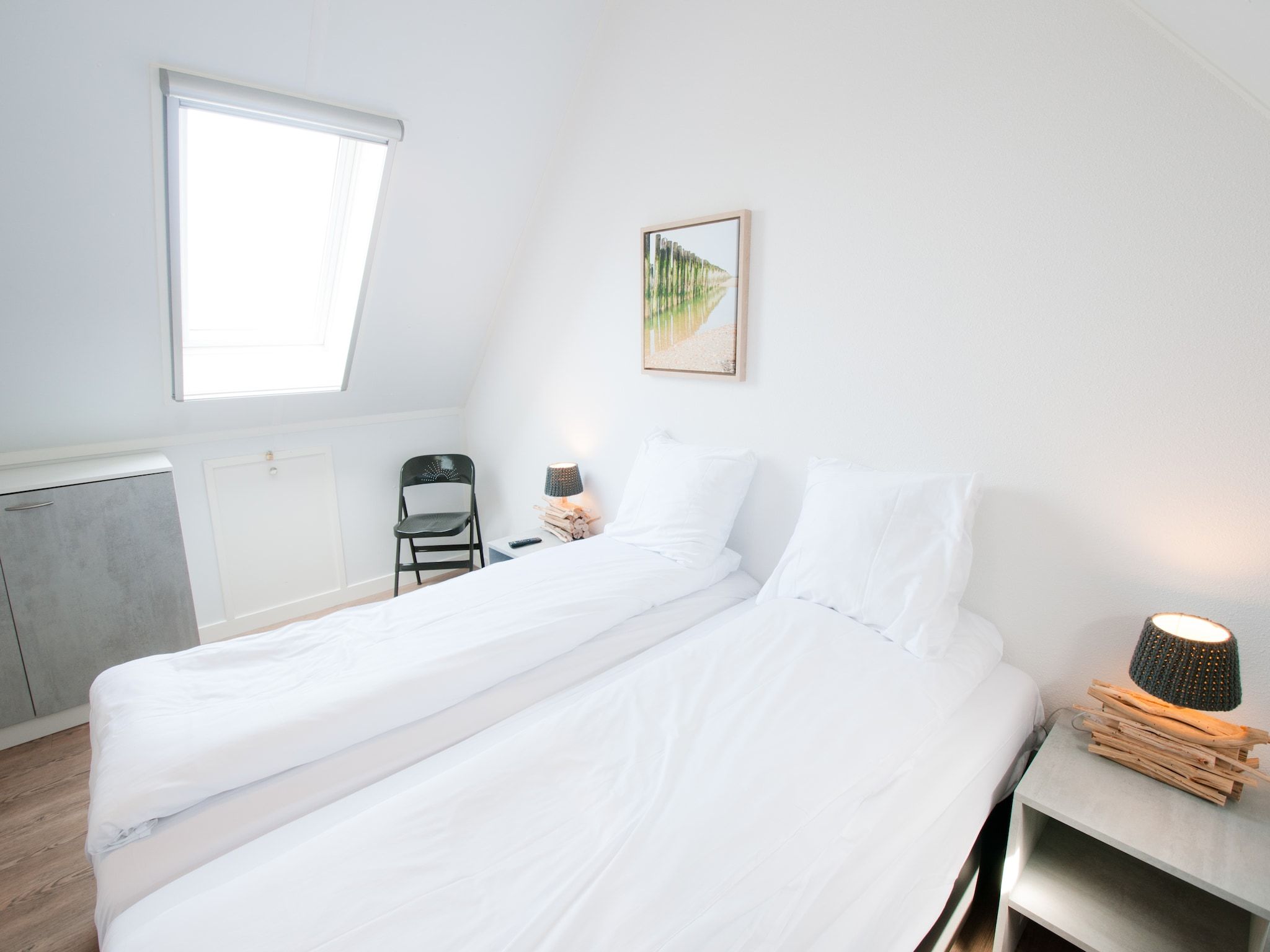 Een slaapkamer van Resort Waterrijk Oesterdam 4 in Tholen