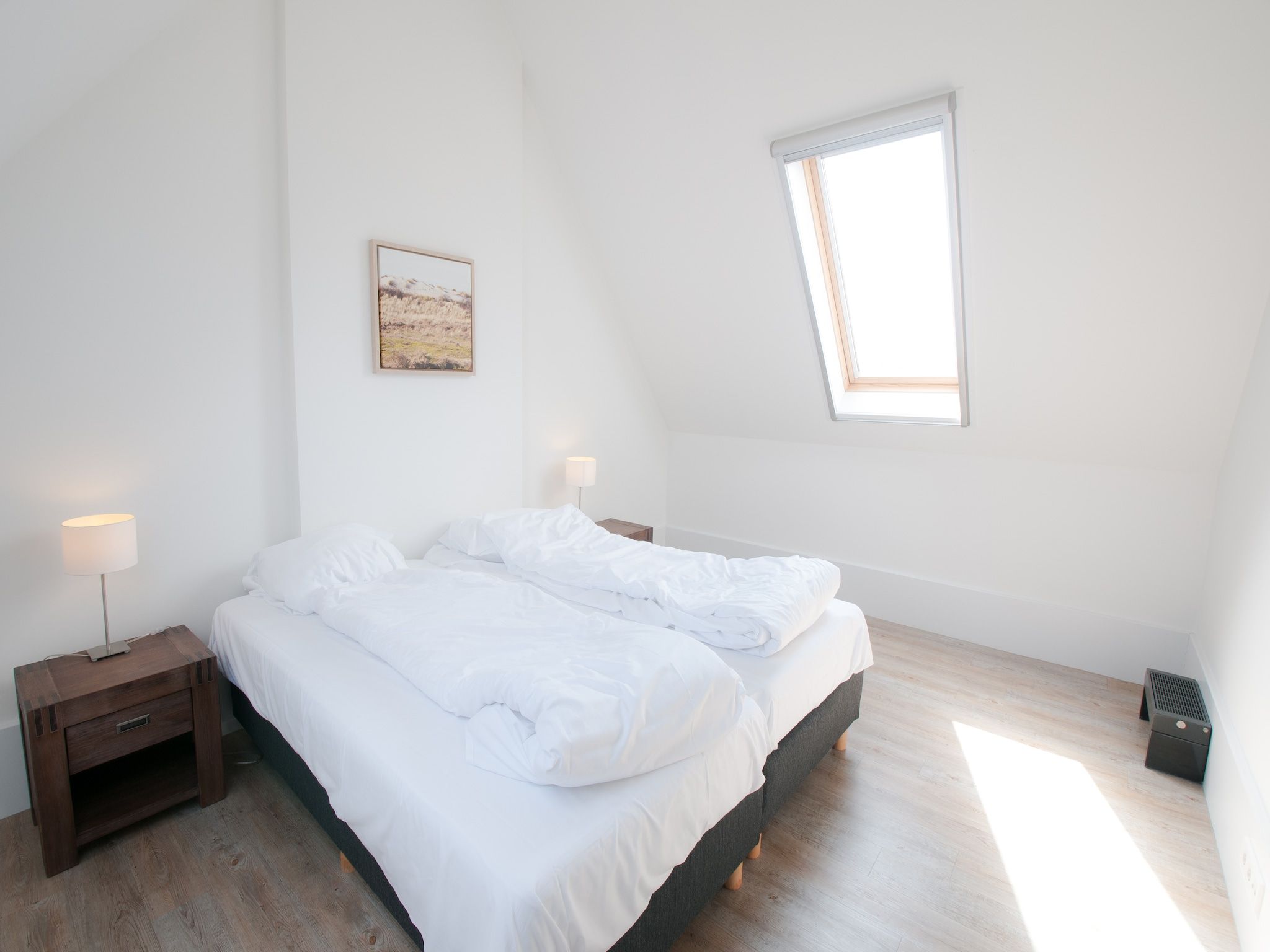 Een slaapkamer van Resort Waterrijk Oesterdam 5 in Tholen