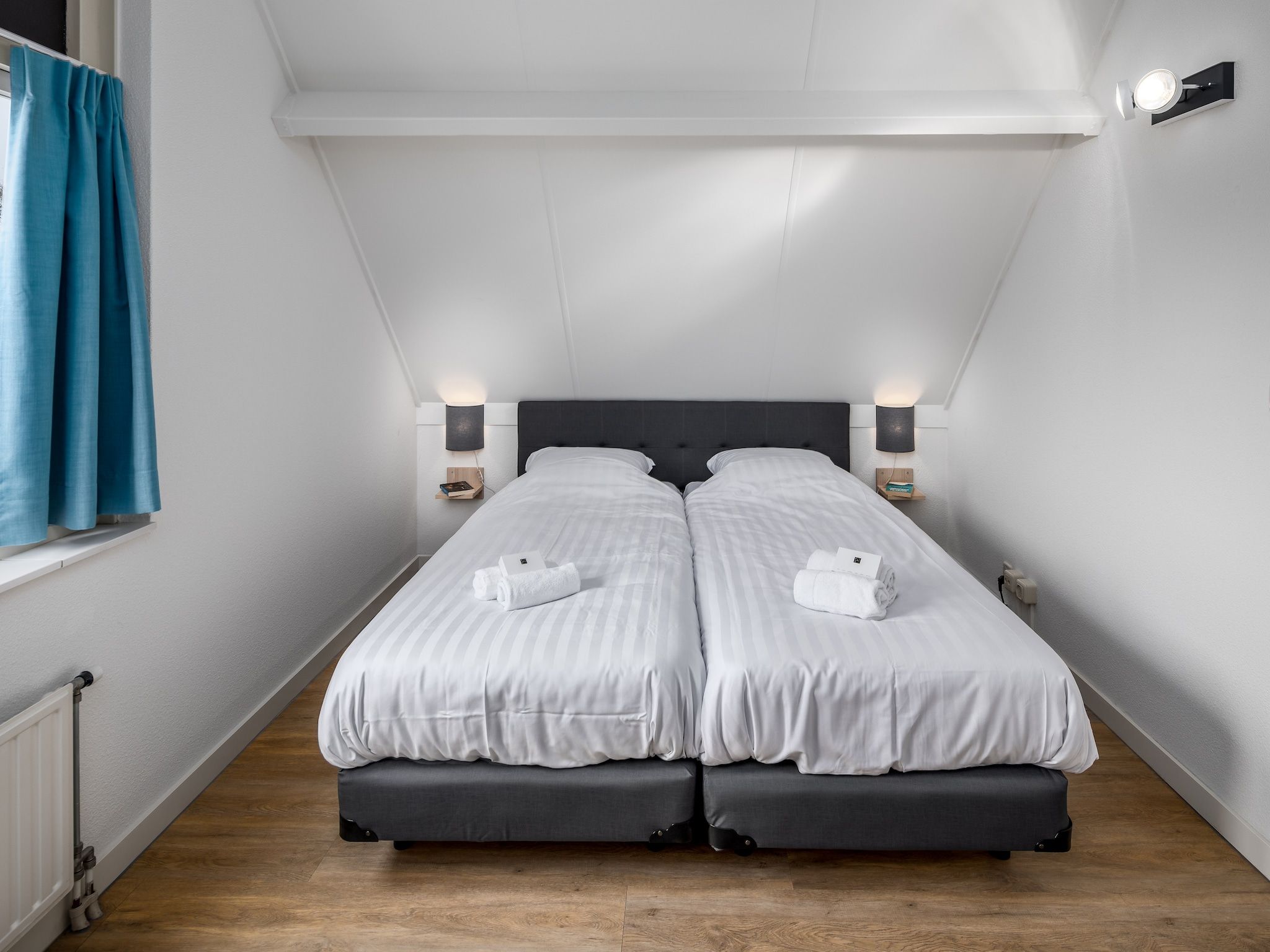 Een slaapkamer van Vakantiepark Zeebad 10 in Breskens