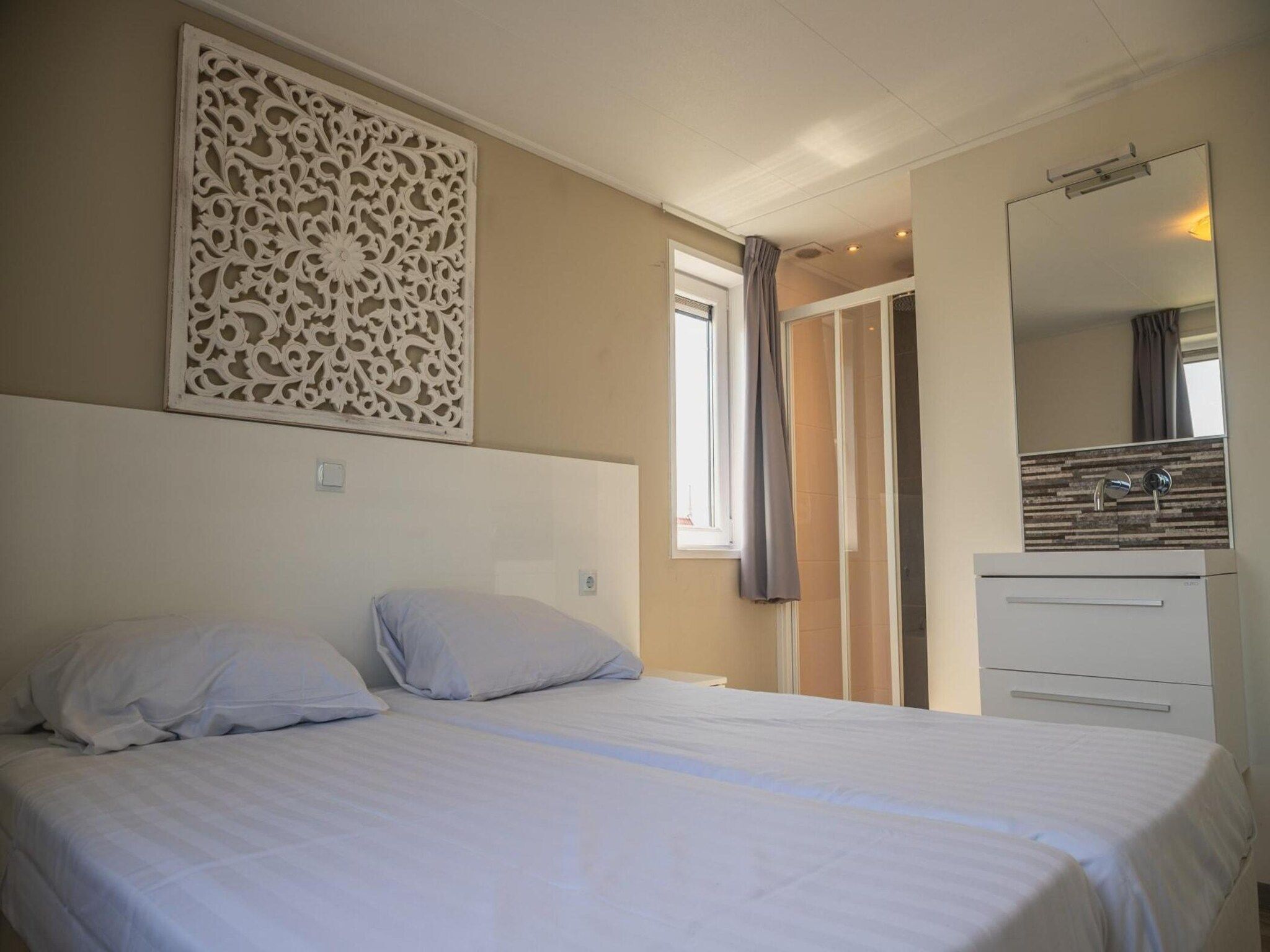 Een slaapkamer van Beemsterdijk met Sauna  10 personen in West-Graftdijk