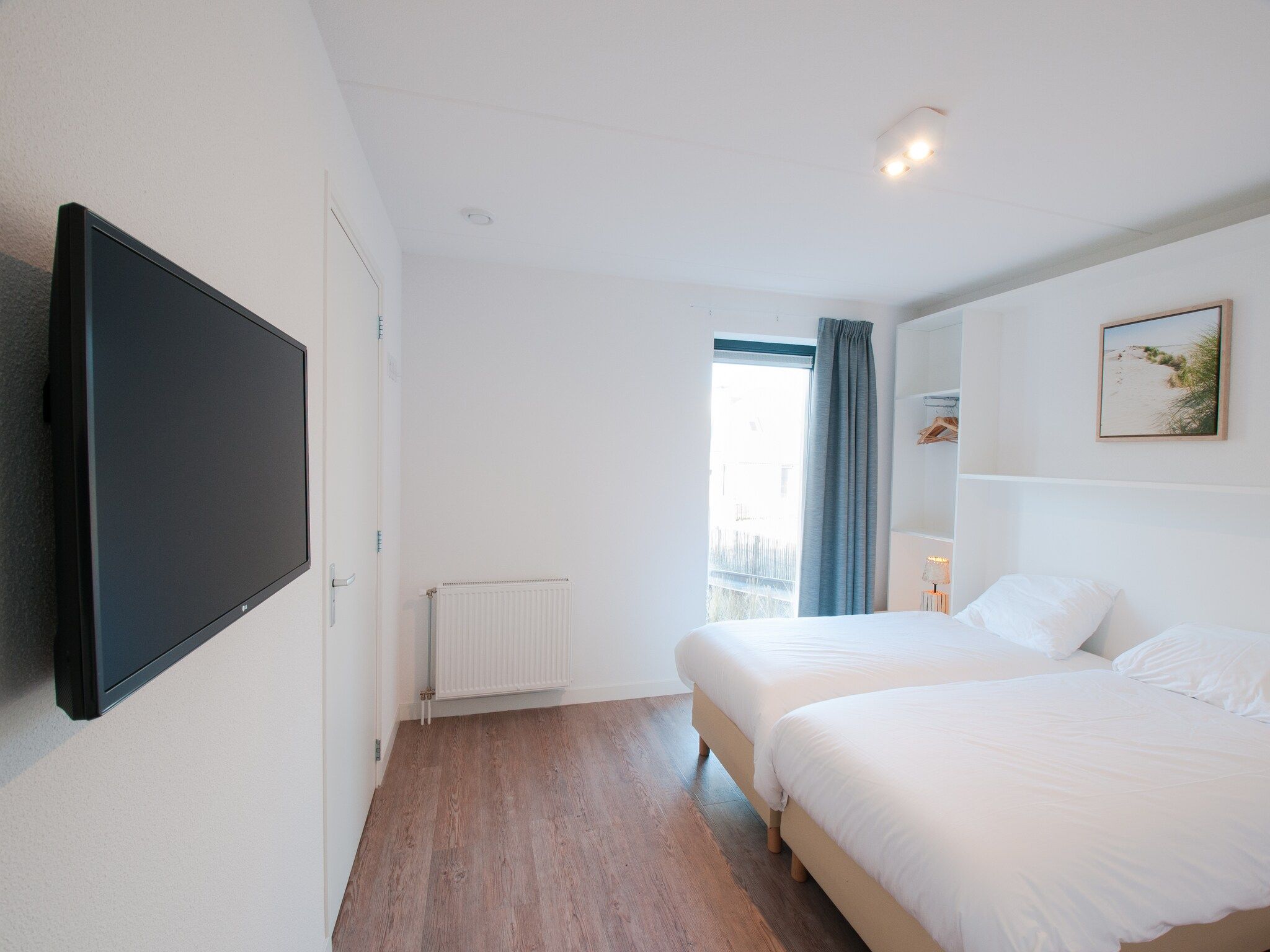 Een slaapkamer van Resort Waterrijk Oesterdam 14 in Tholen