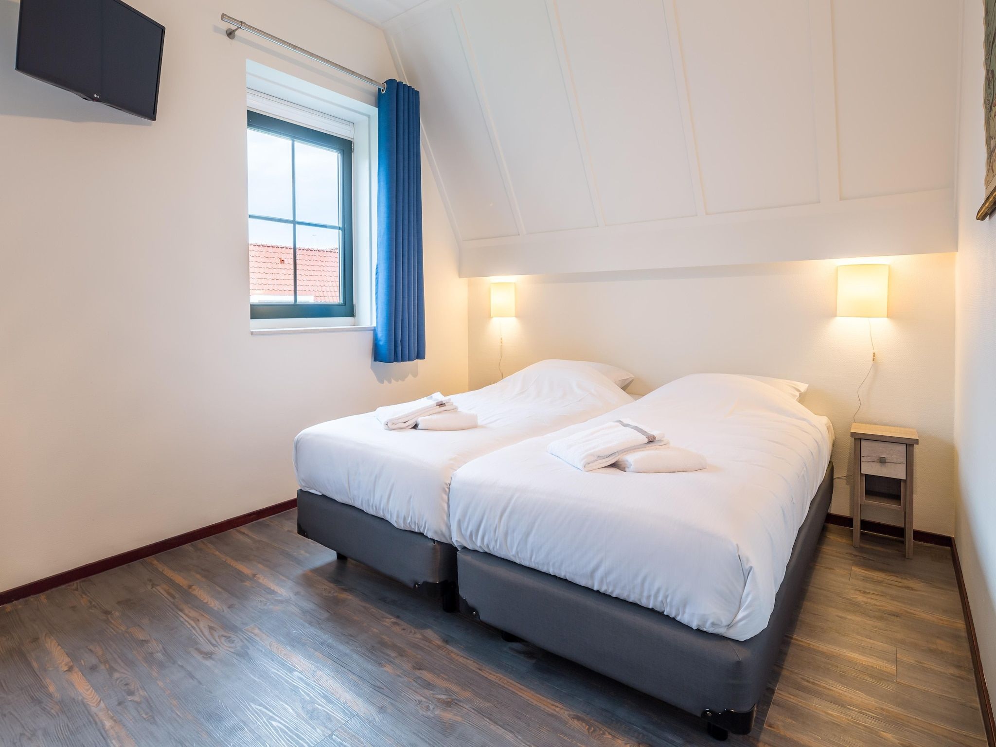 Een slaapkamer van Marinapark Volendam 13 in Volendam