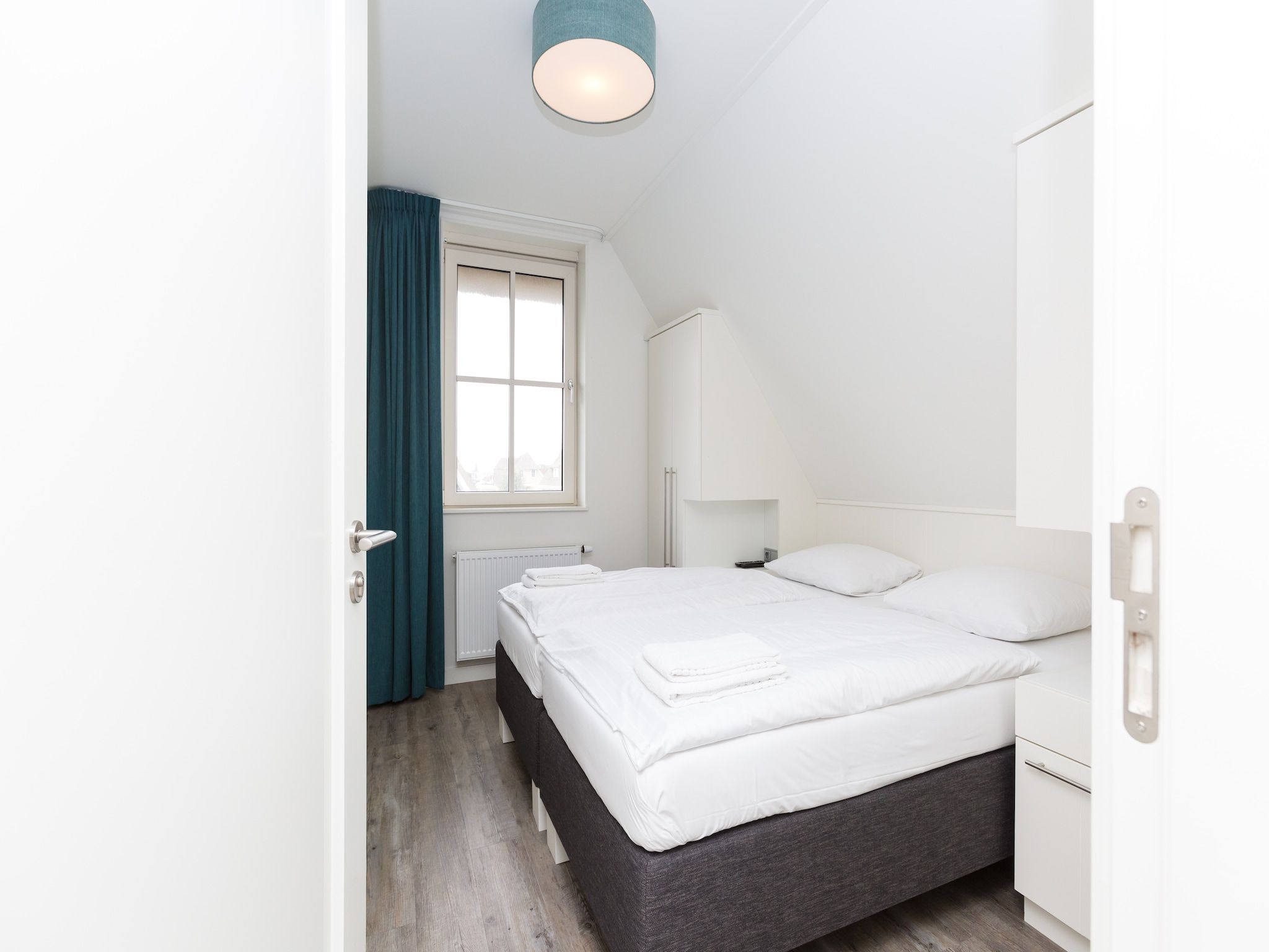 Een slaapkamer van Friese Meren Villa's 10 in Delfstrahuizen