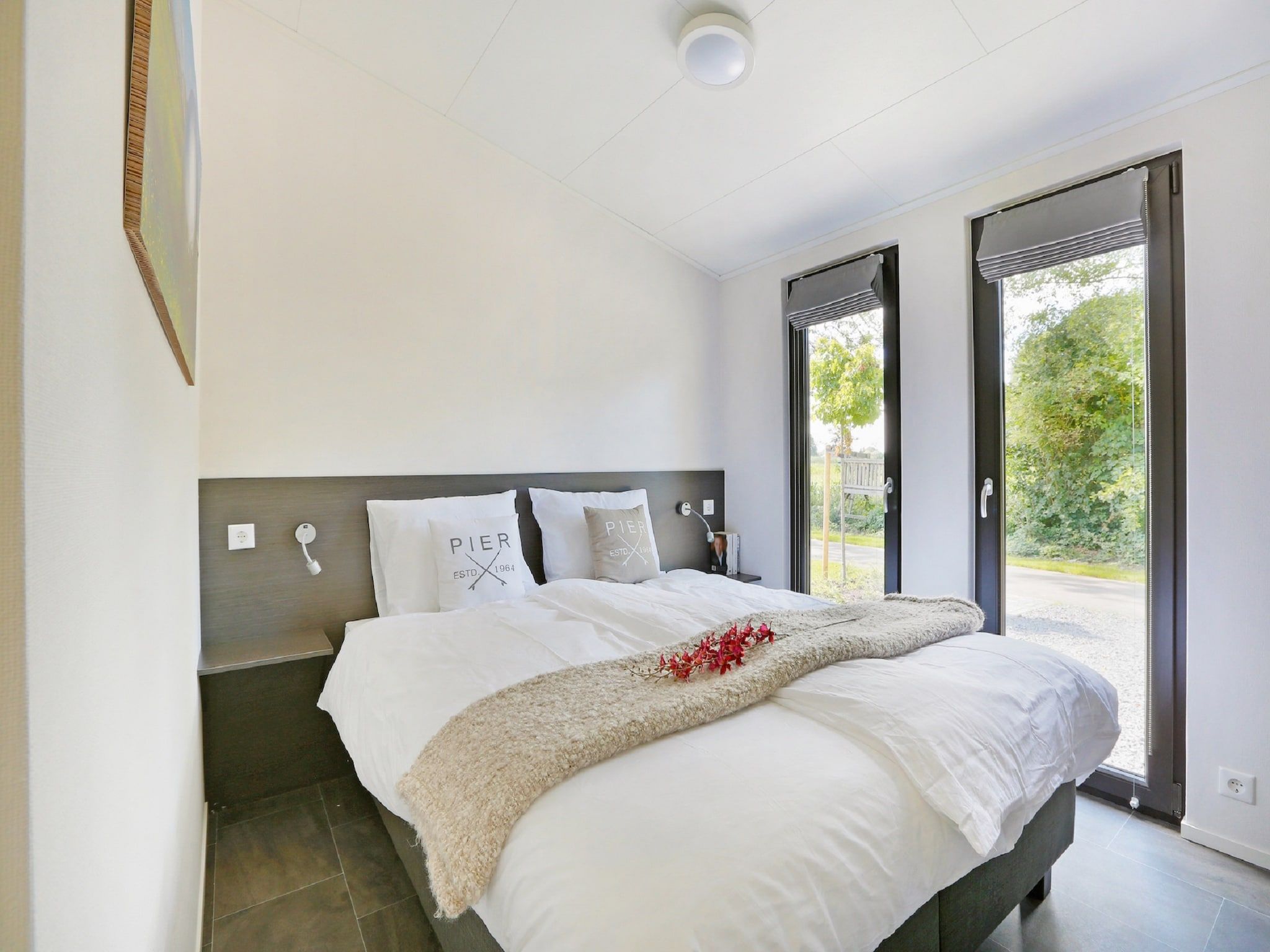 Een slaapkamer van Vakantiepark De Lochemse Berg 1 in Lochem