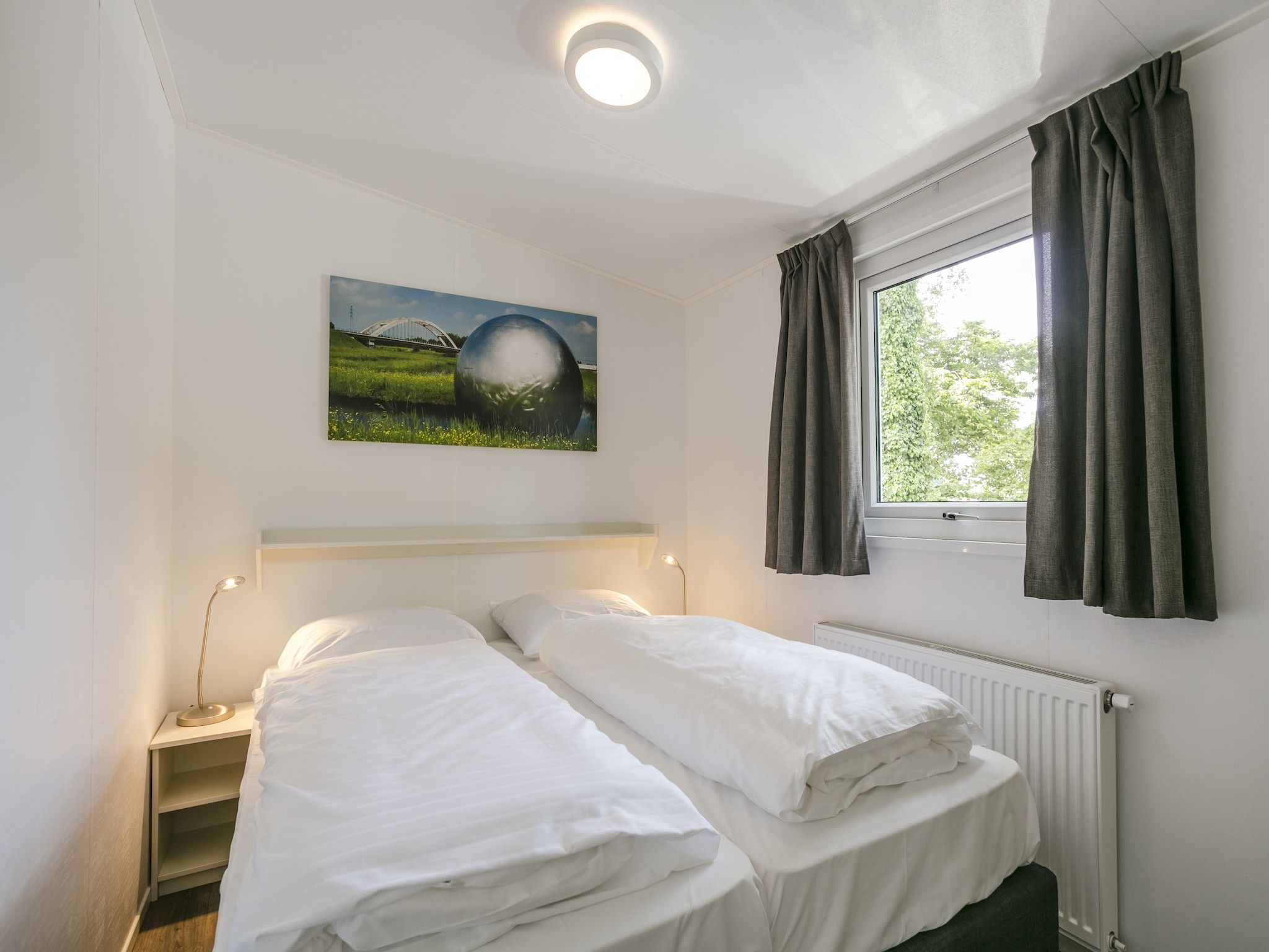 Een slaapkamer van Vakantiepark De Lochemse Berg 2 in Lochem