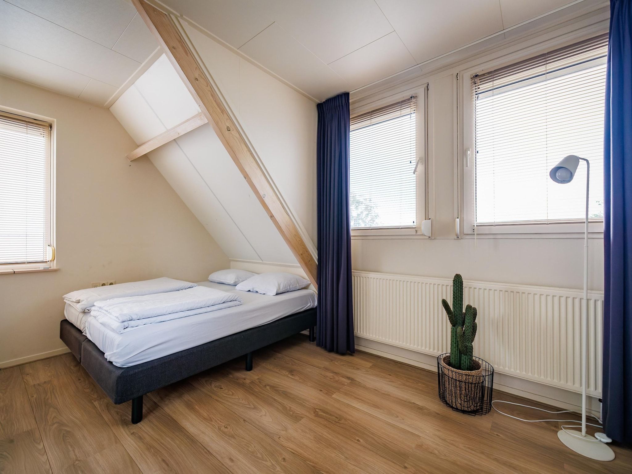 Een slaapkamer van Vakantiepark Eiland van Maurik 4 in Maurik