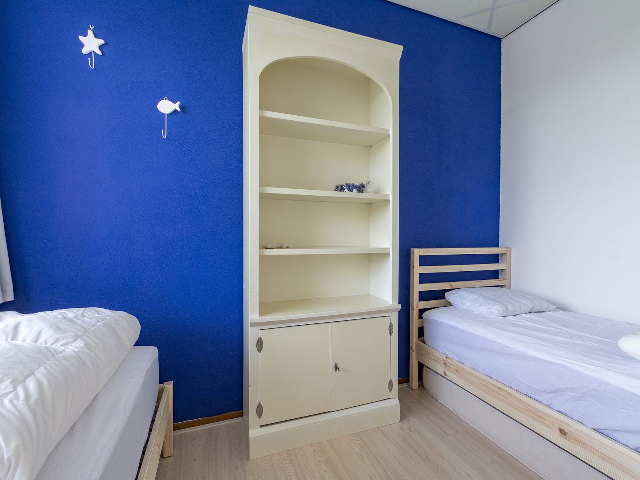 Een slaapkamer van Strandslag 115 in Julianadorp aan Zee