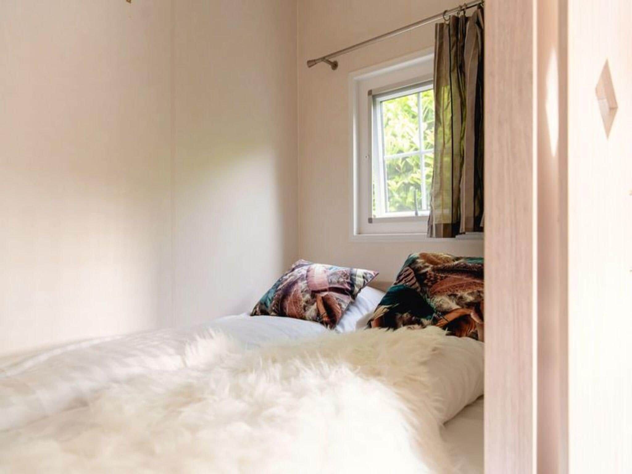 Een slaapkamer van Vakantiepark Mölke 24 in Zuna