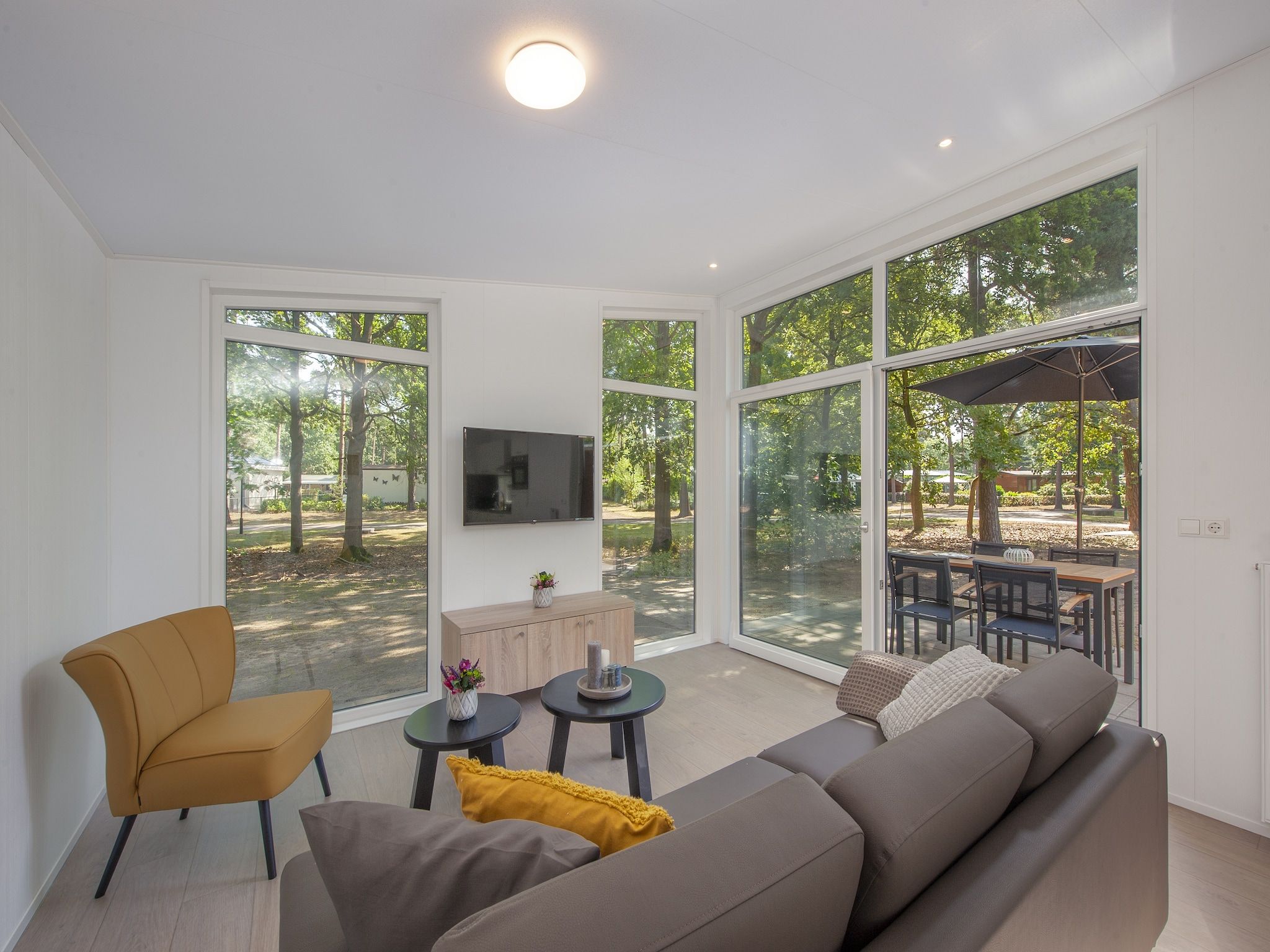 De woonkamer van Bospark 't Wolfsven 10 in Mierlo