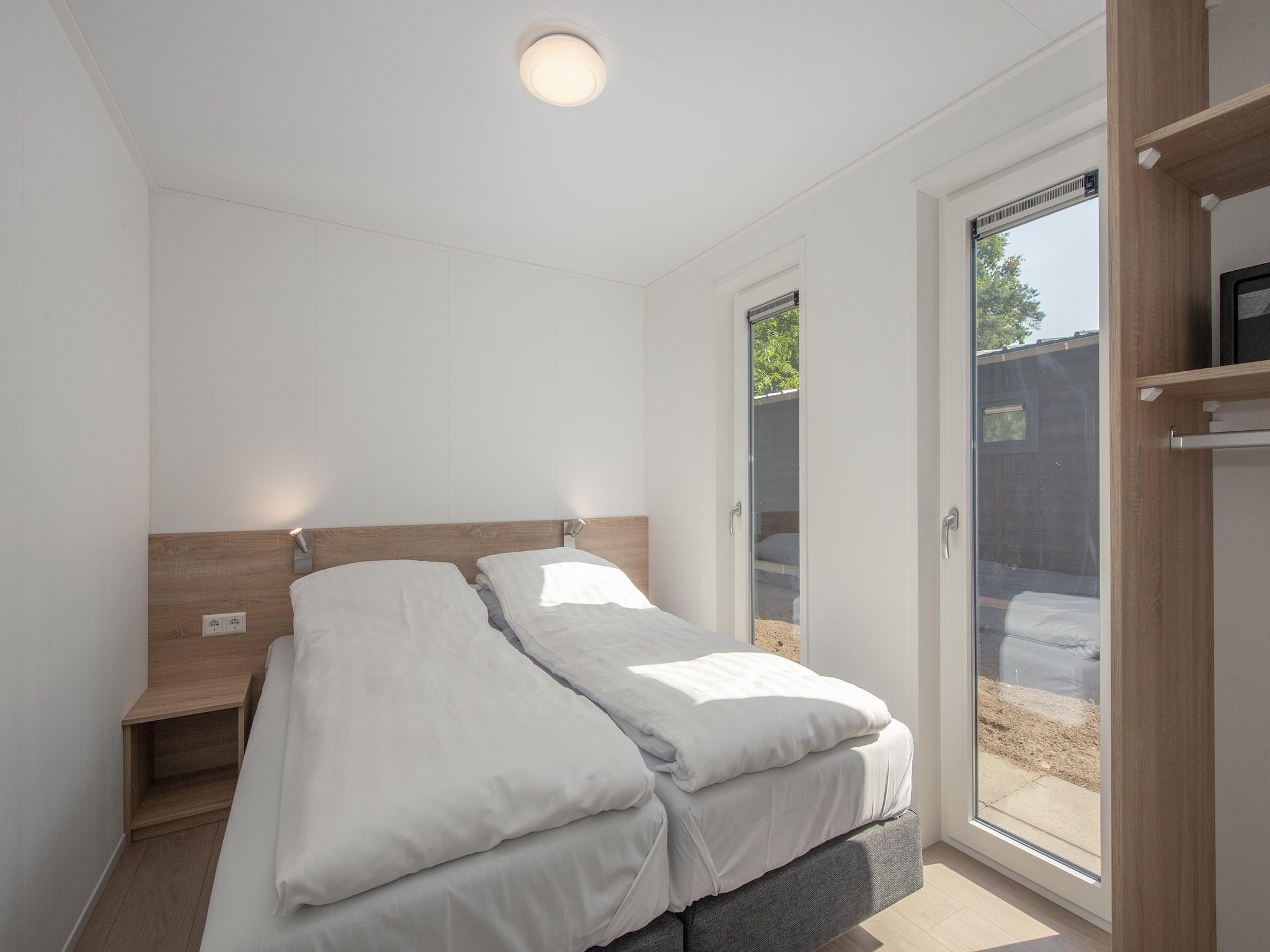 Een slaapkamer van Bospark 't Wolfsven 11 in Mierlo