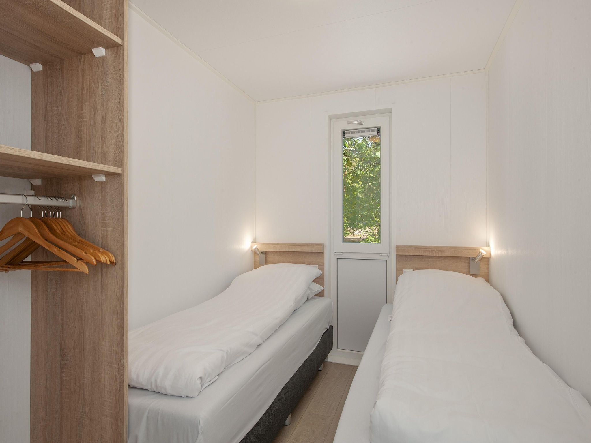 Een slaapkamer van Bospark 't Wolfsven 11 in Mierlo