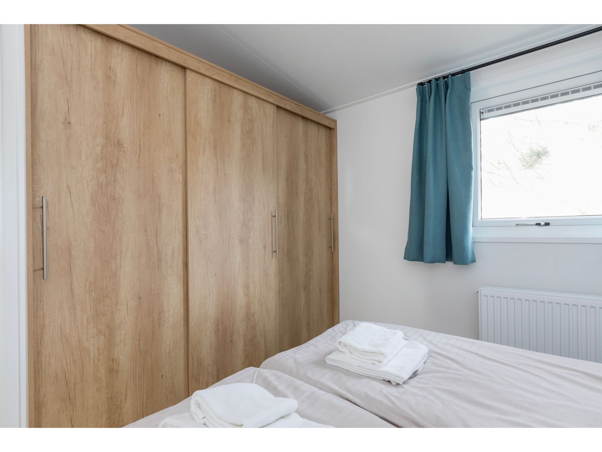 Een slaapkamer van Fort den Haak - Chalet 1 tm 15  hond in Vrouwenpolder