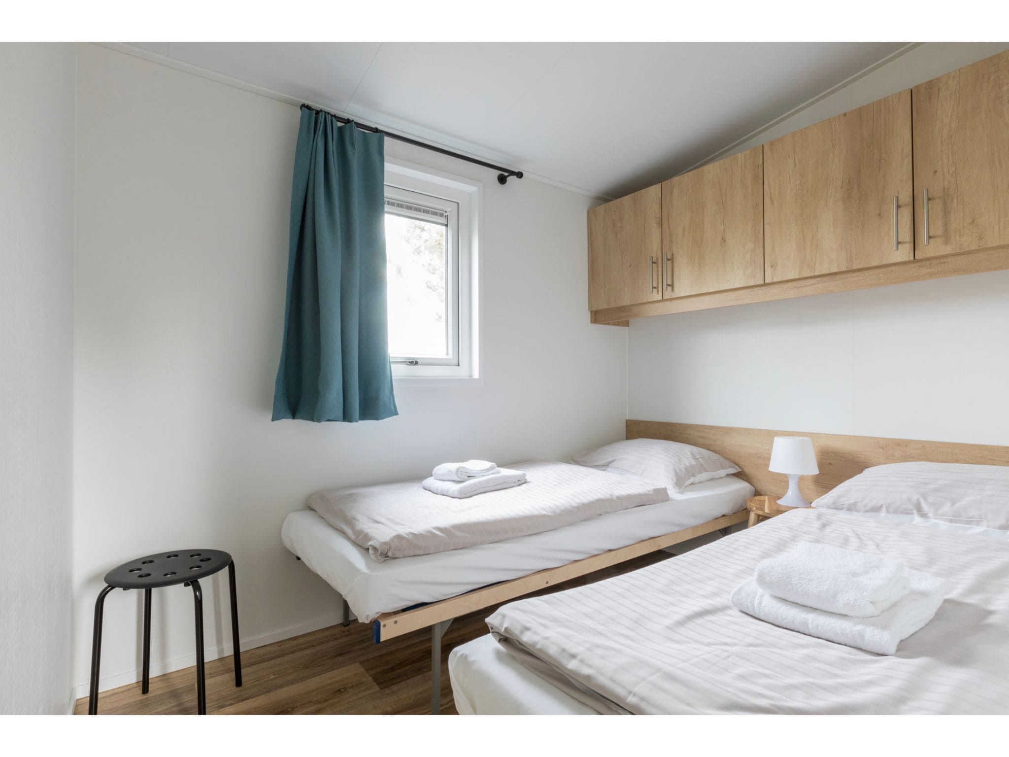 Een slaapkamer van Fort den Haak - Chalet 1 t/m 10 huisdiervrij in Vrouwenpolder