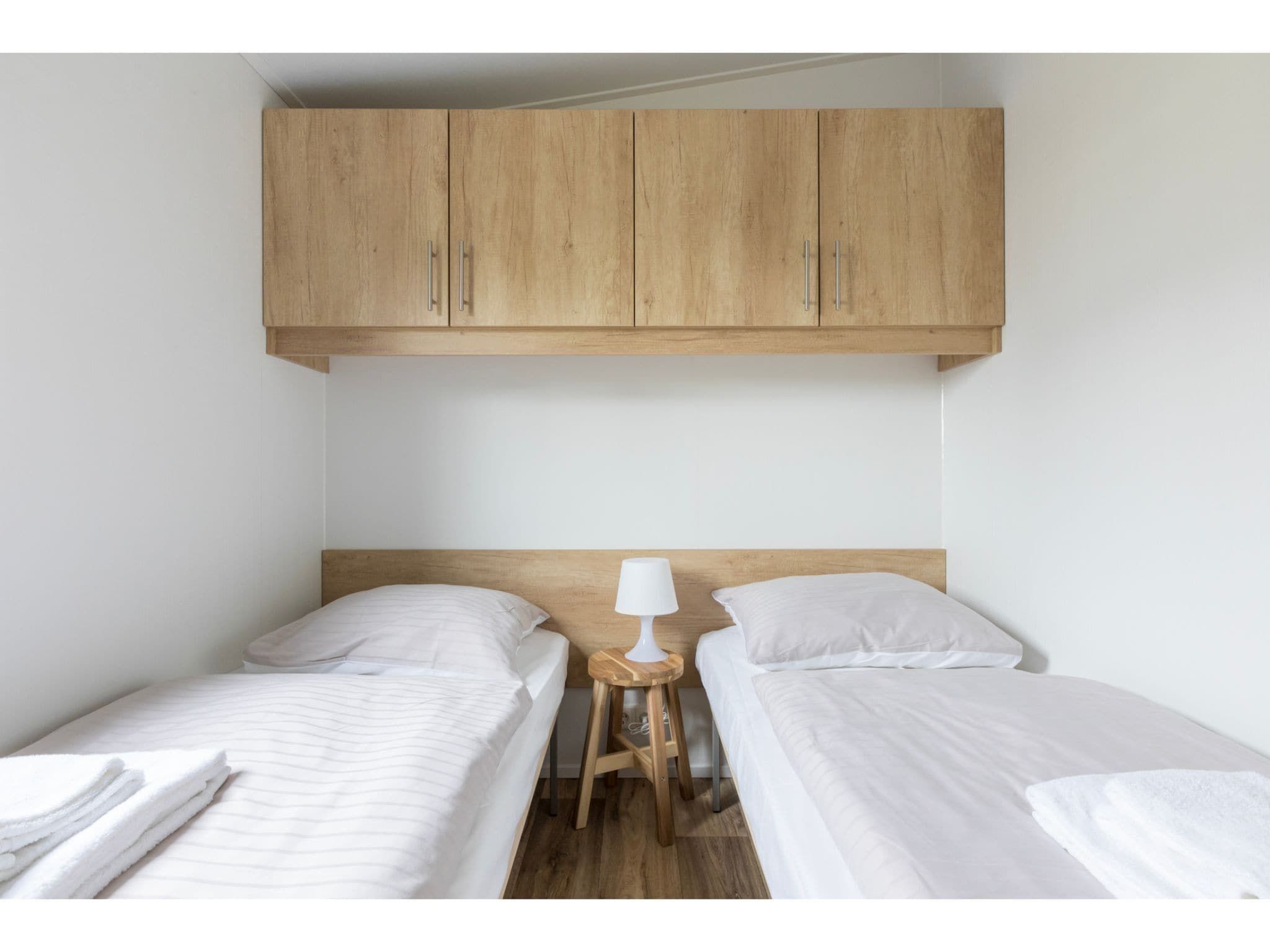 Een slaapkamer van Fort den Haak - Chalet 1 t/m 10 huisdiervrij in Vrouwenpolder