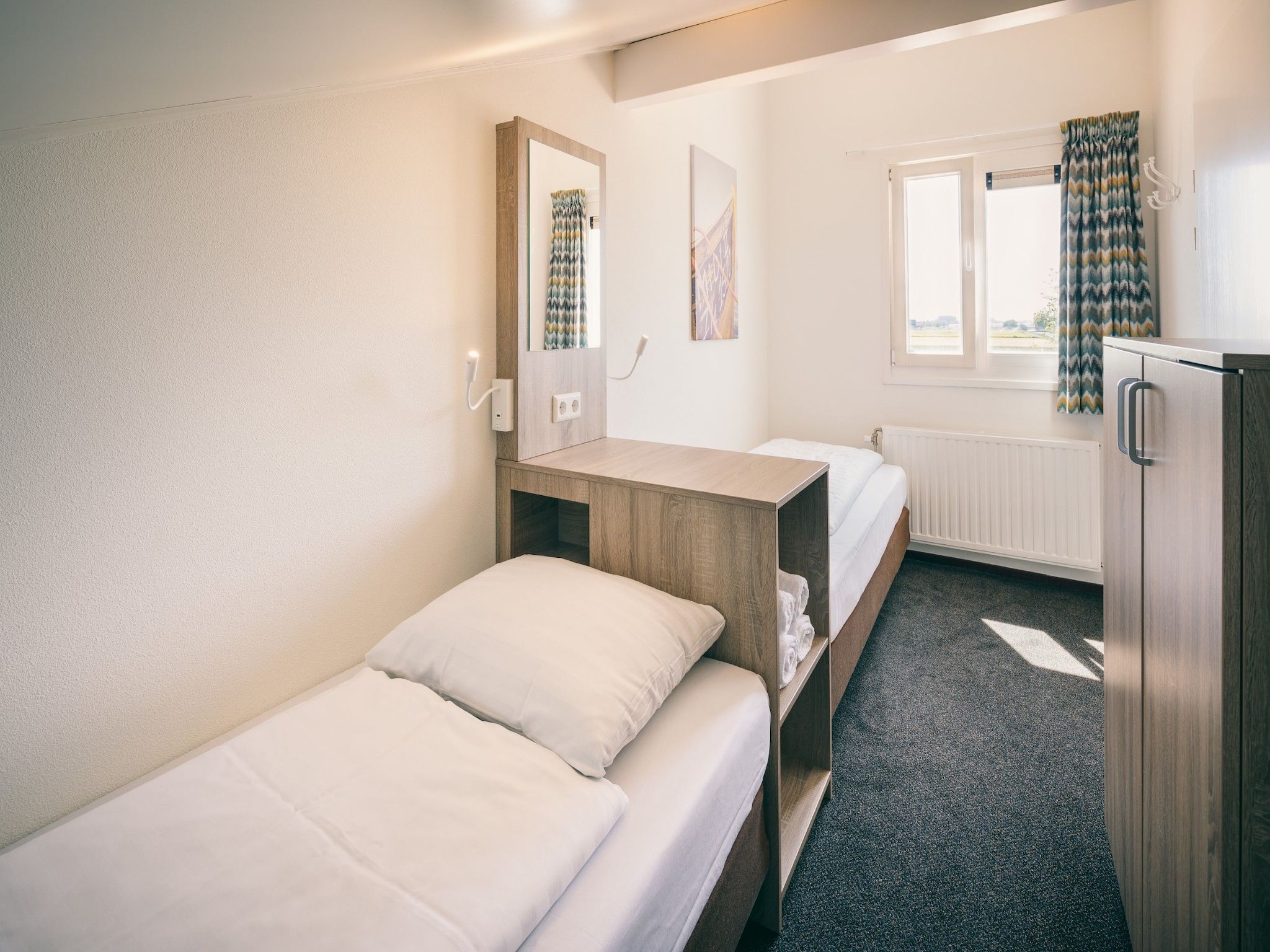 Een slaapkamer van Duinresort Dunimar 1 in Noordwijkerhout