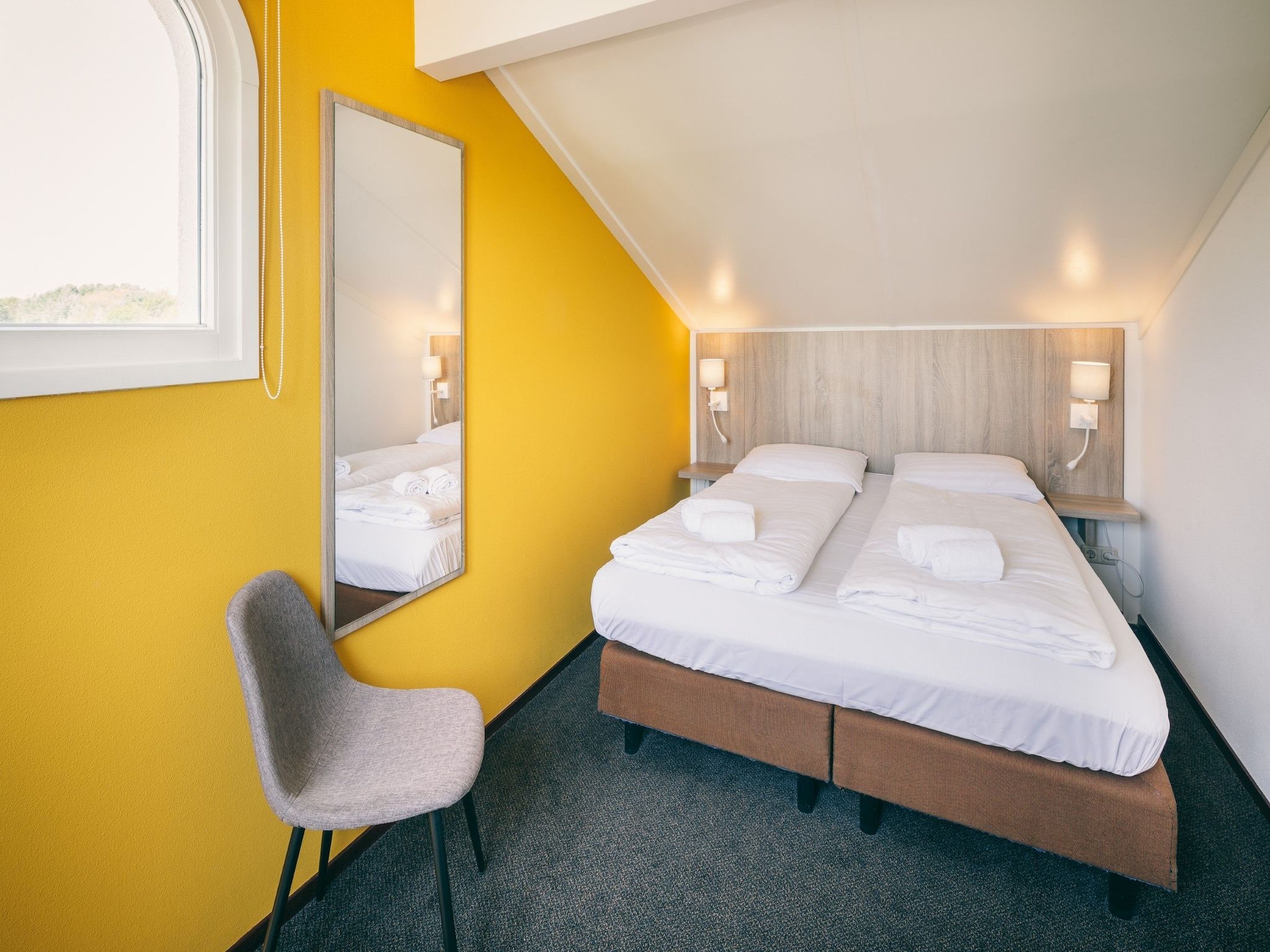 Een slaapkamer van Duinresort Dunimar 2 in Noordwijkerhout