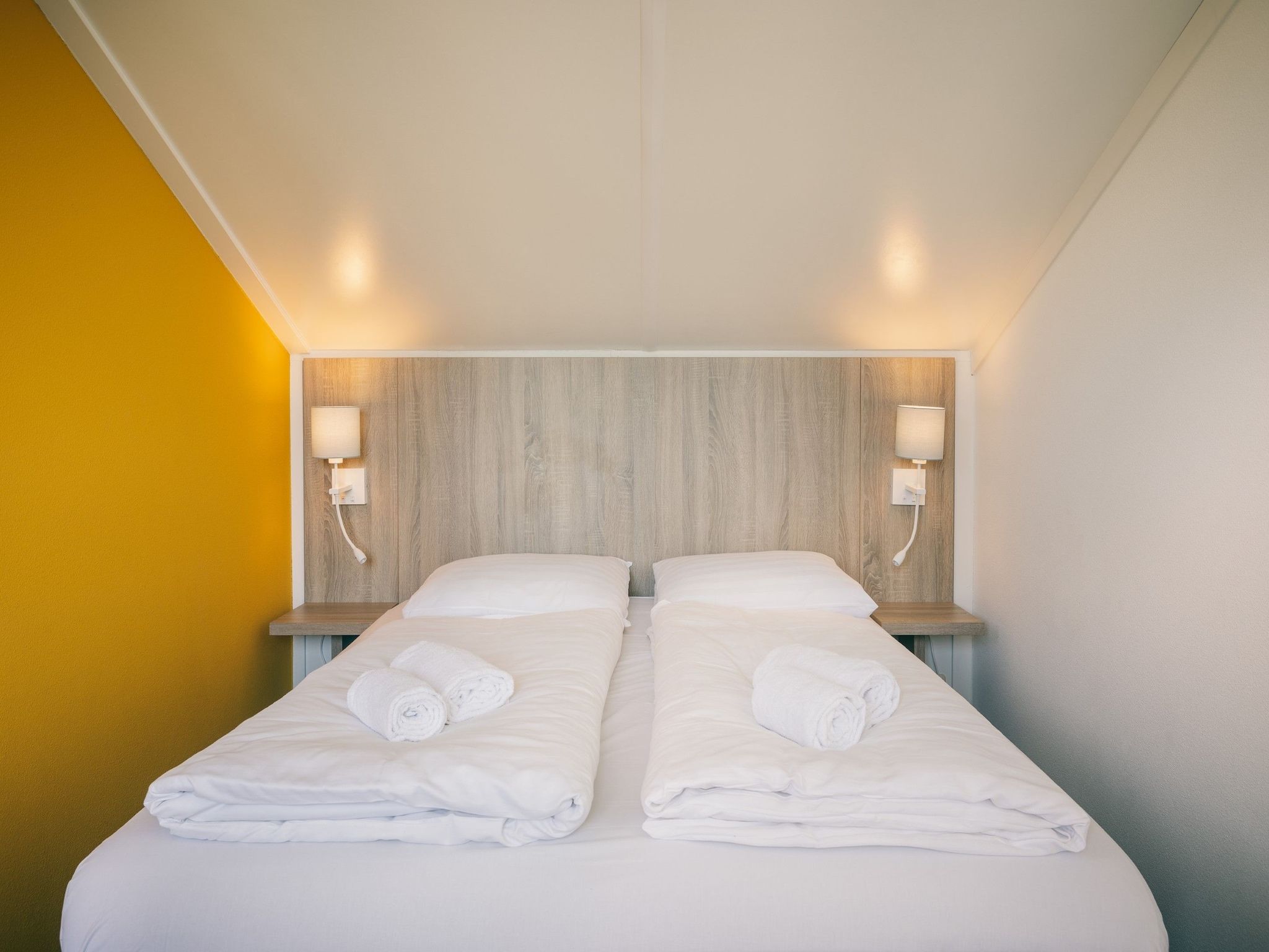 Een slaapkamer van Duinresort Dunimar 2 in Noordwijkerhout