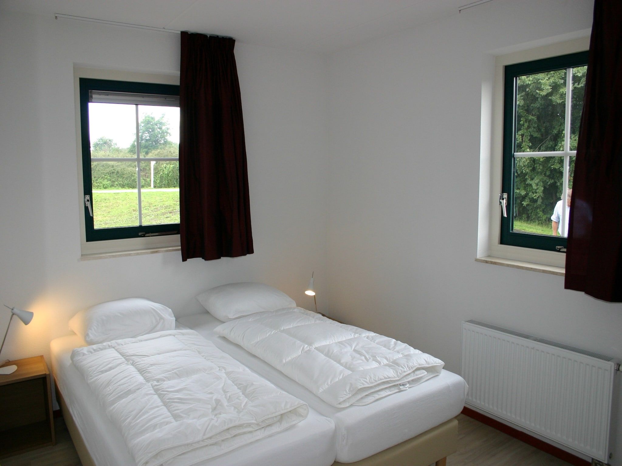 Een slaapkamer van Vakantiepark Emslandermeer 11 in Vlagtwedde