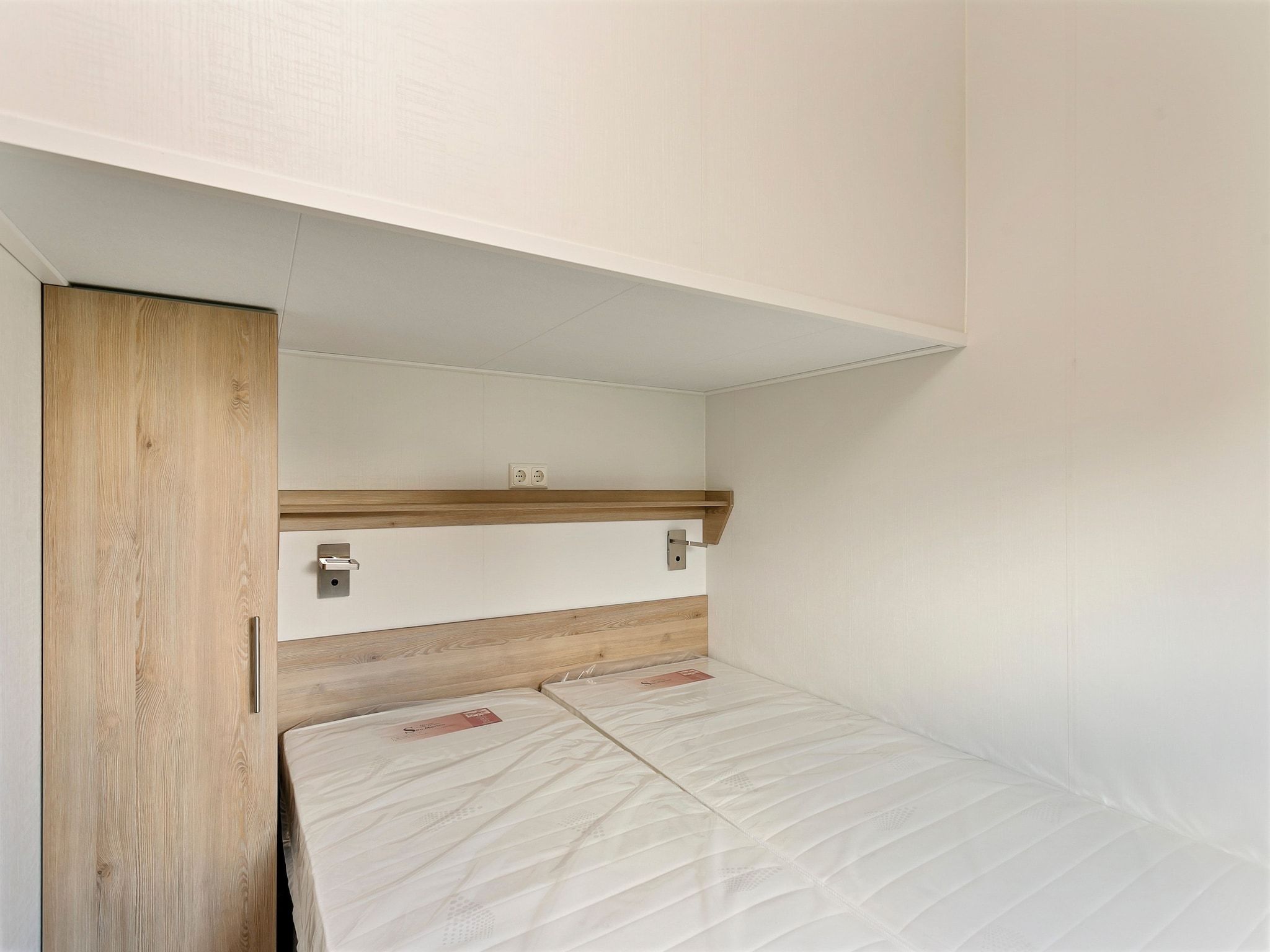 Een slaapkamer van Recreatiepark Tolplas 16 in Hoge Hexel