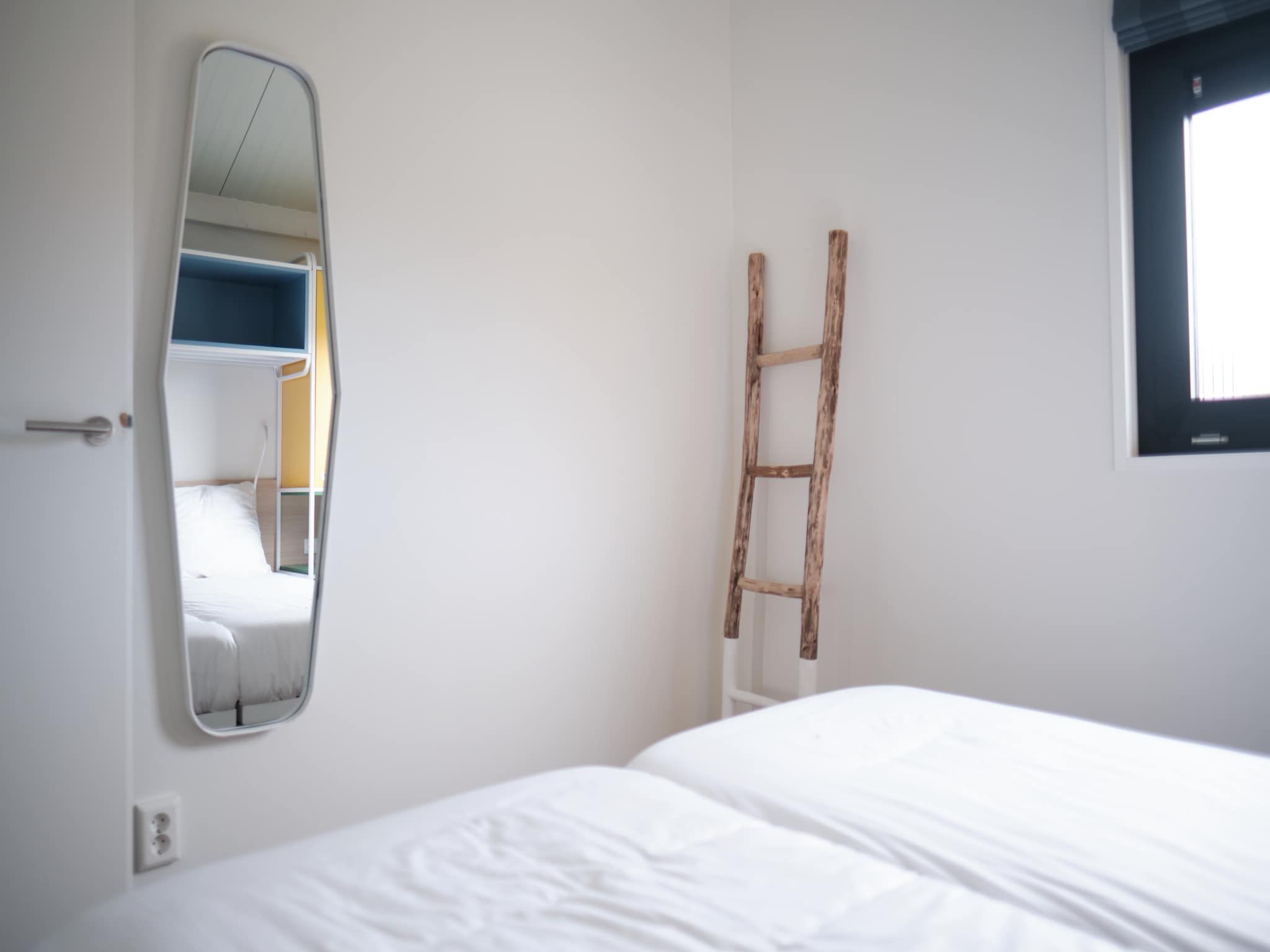 Een slaapkamer van Resort Callantsoog 1 in Callantsoog