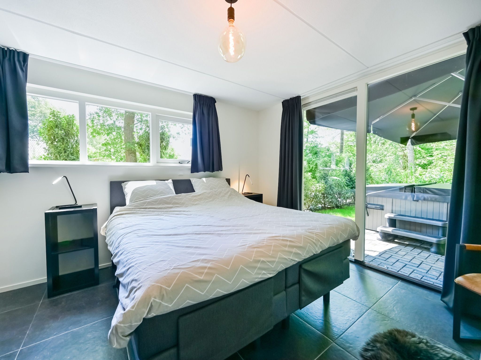 Een slaapkamer van Uitzicht in Reutum