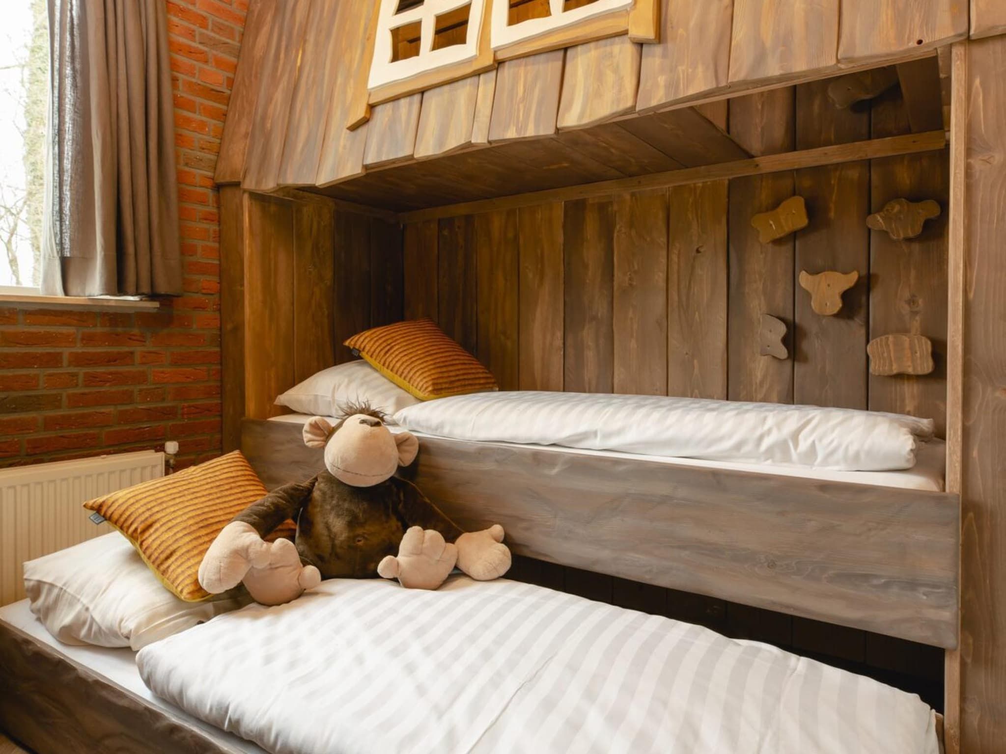 Een slaapkamer van Vakantiepark Mölke 18 in Zuna