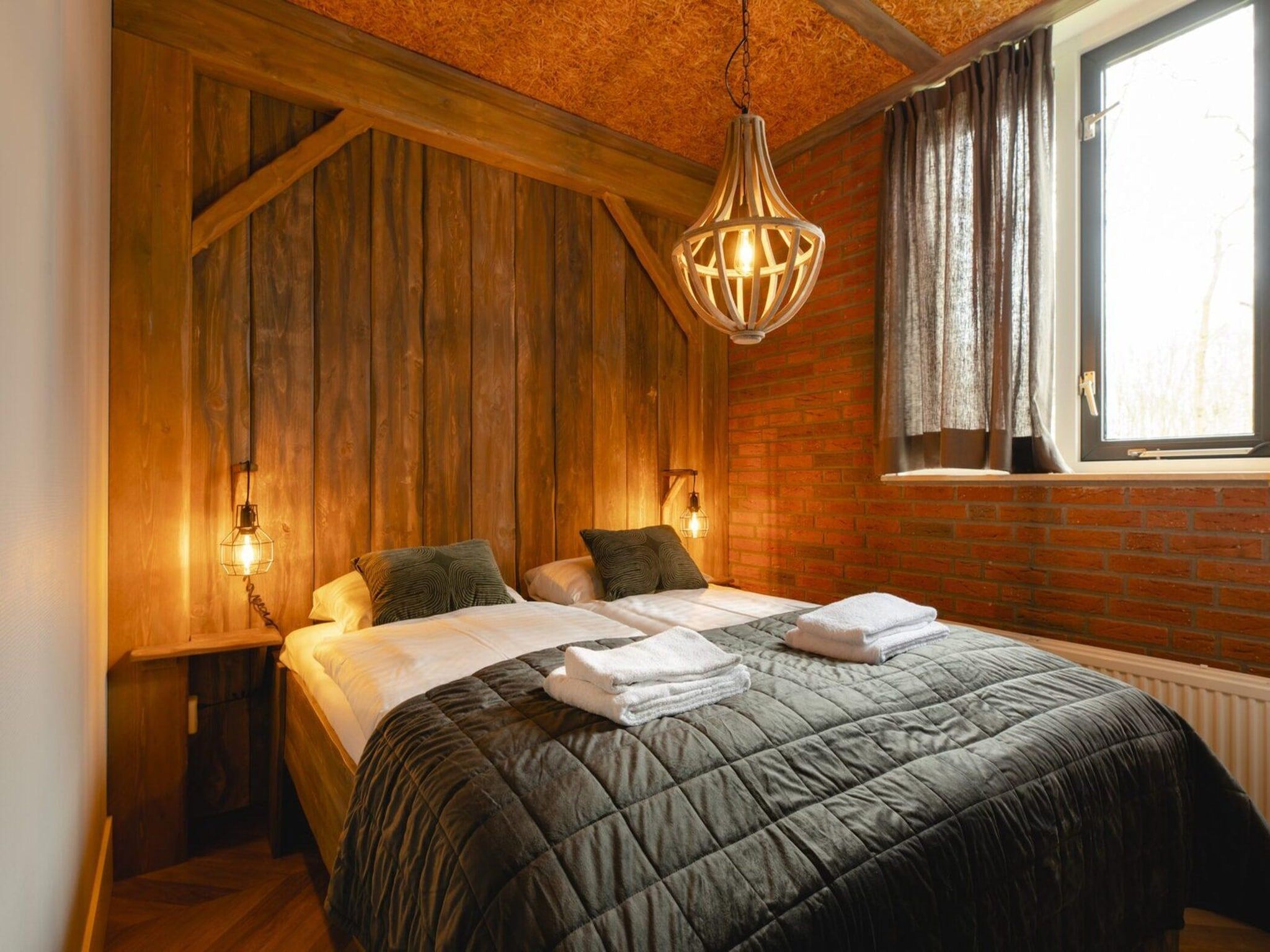 Een slaapkamer van Vakantiepark Mölke 18 in Zuna