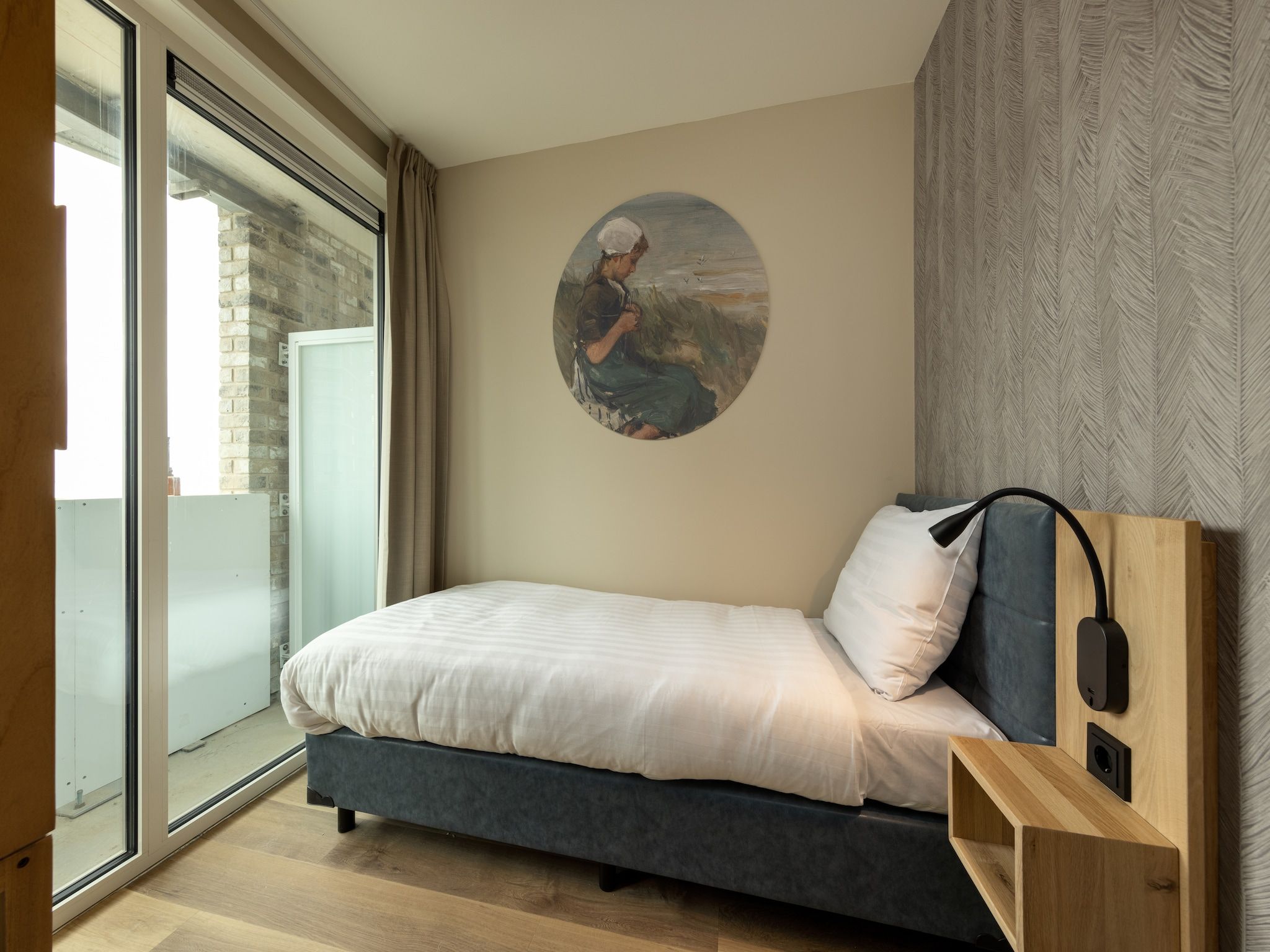 Een slaapkamer van Residentie de Graaf van Egmont 10 in Egmond aan zee