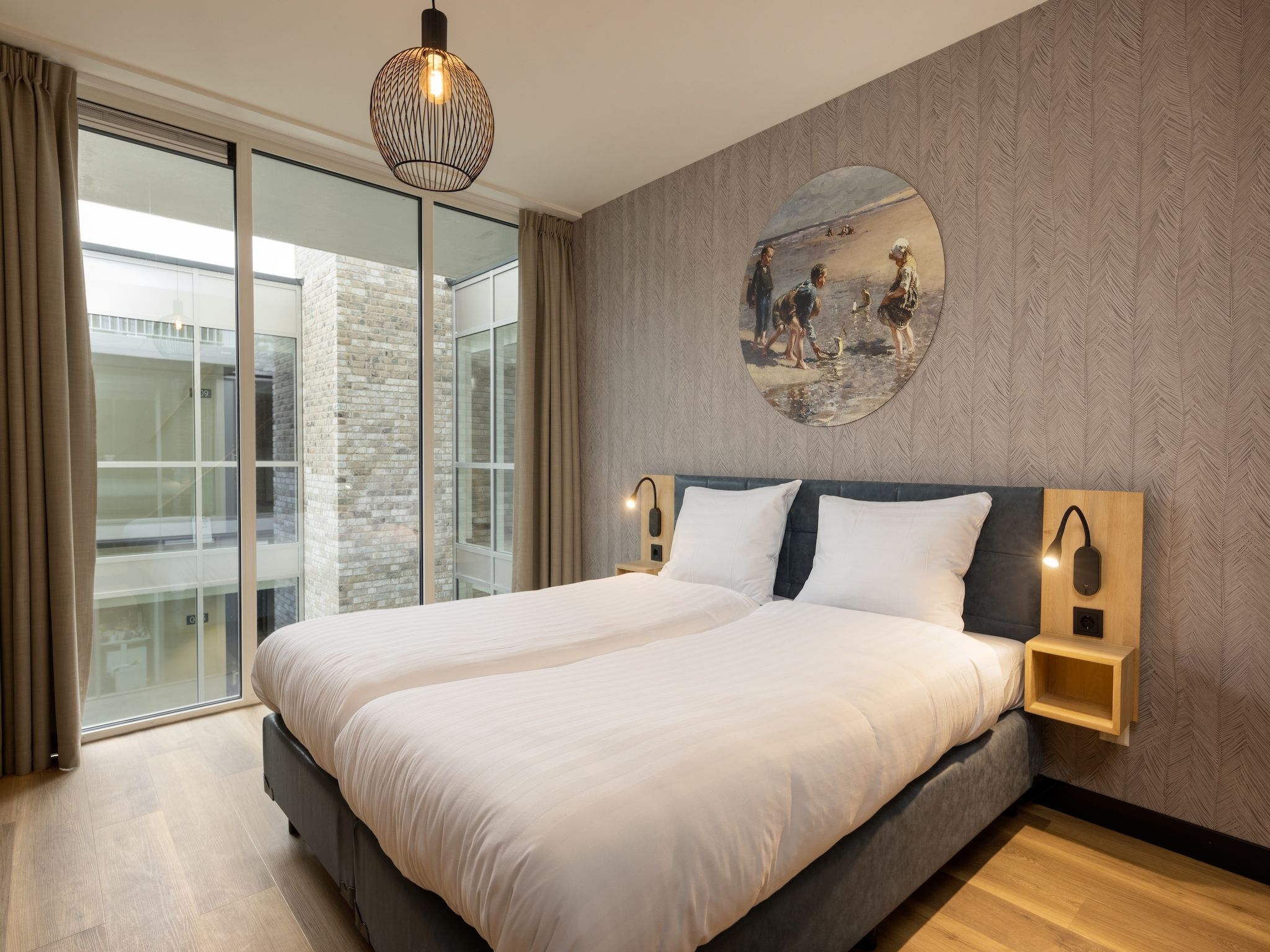 Een slaapkamer van Residentie de Graaf van Egmont 11 in Egmond aan zee