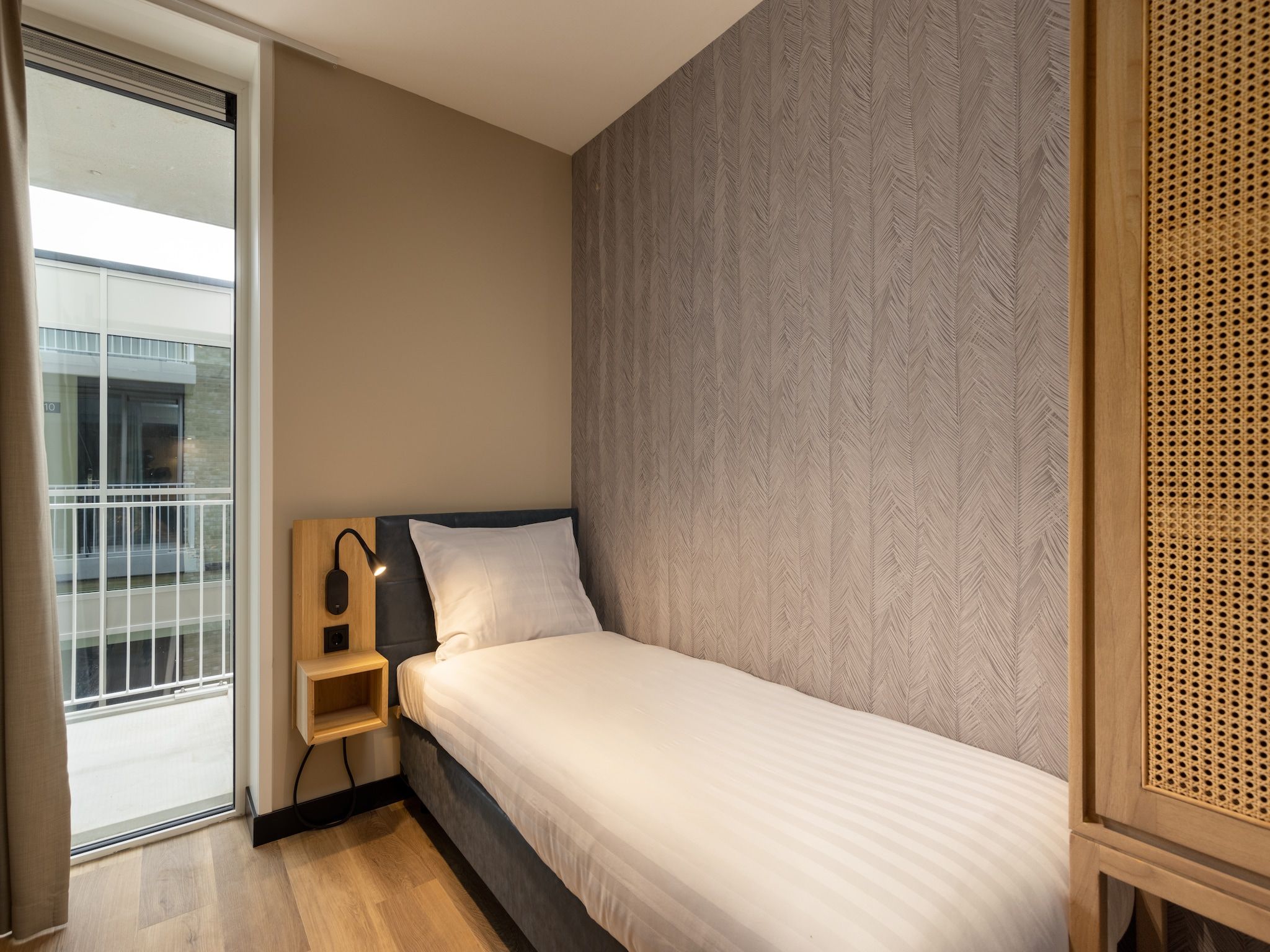 Een slaapkamer van Residentie de Graaf van Egmont 11 in Egmond aan zee