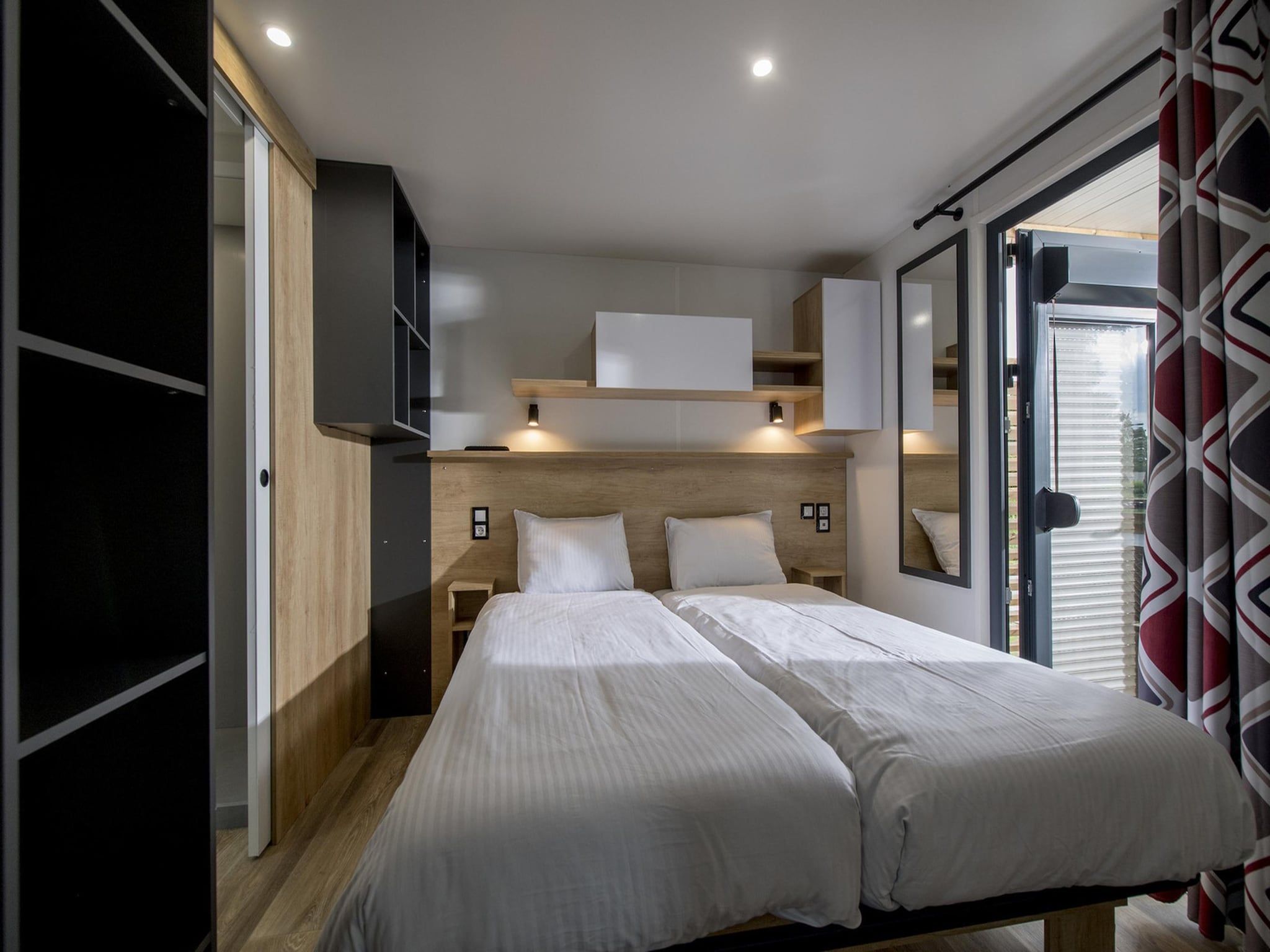 Een slaapkamer van Vakantiepark Eiland van Maurik 7 in Maurik