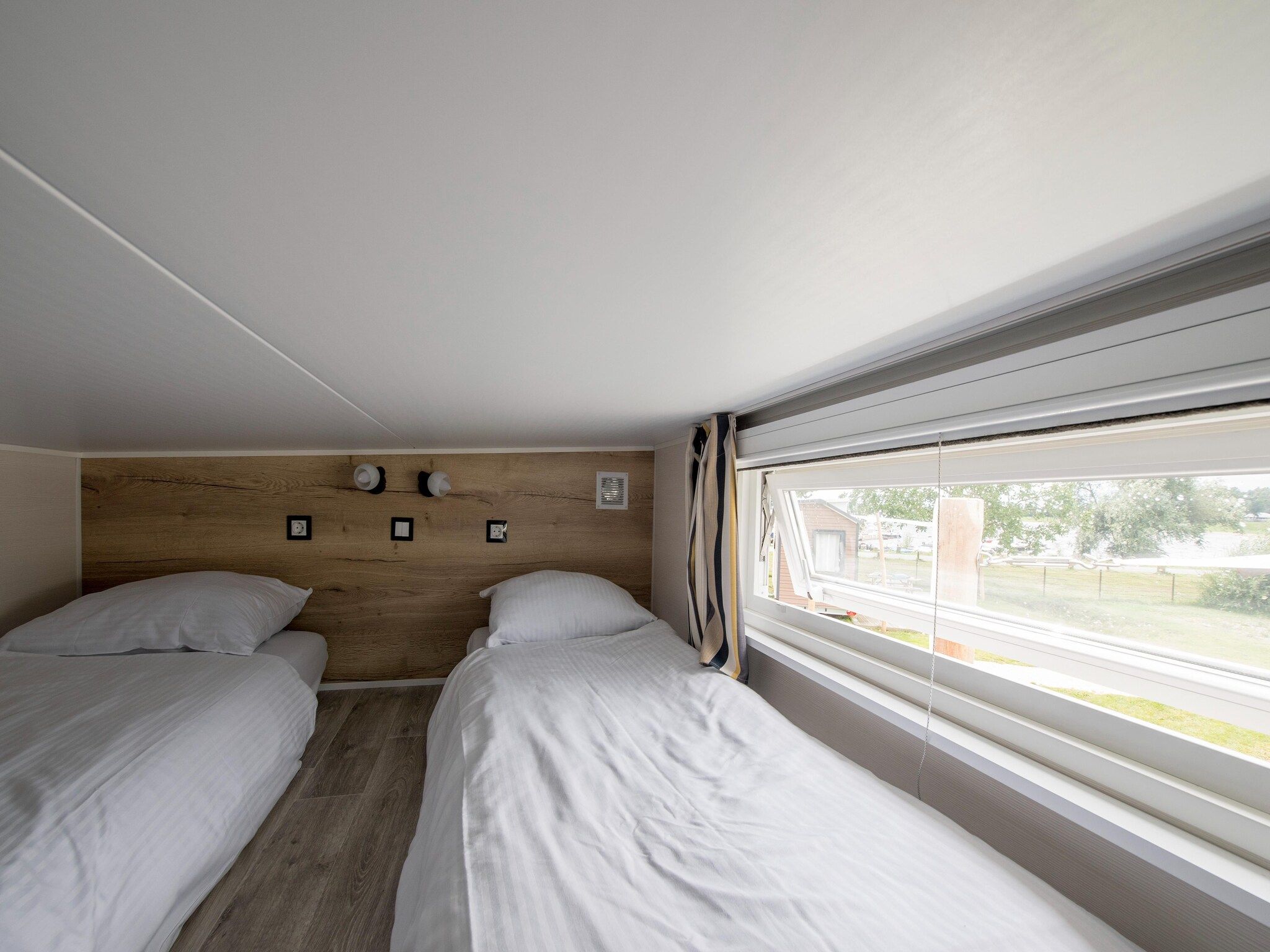 Een slaapkamer van Vakantiepark Eiland van Maurik 9 in Maurik