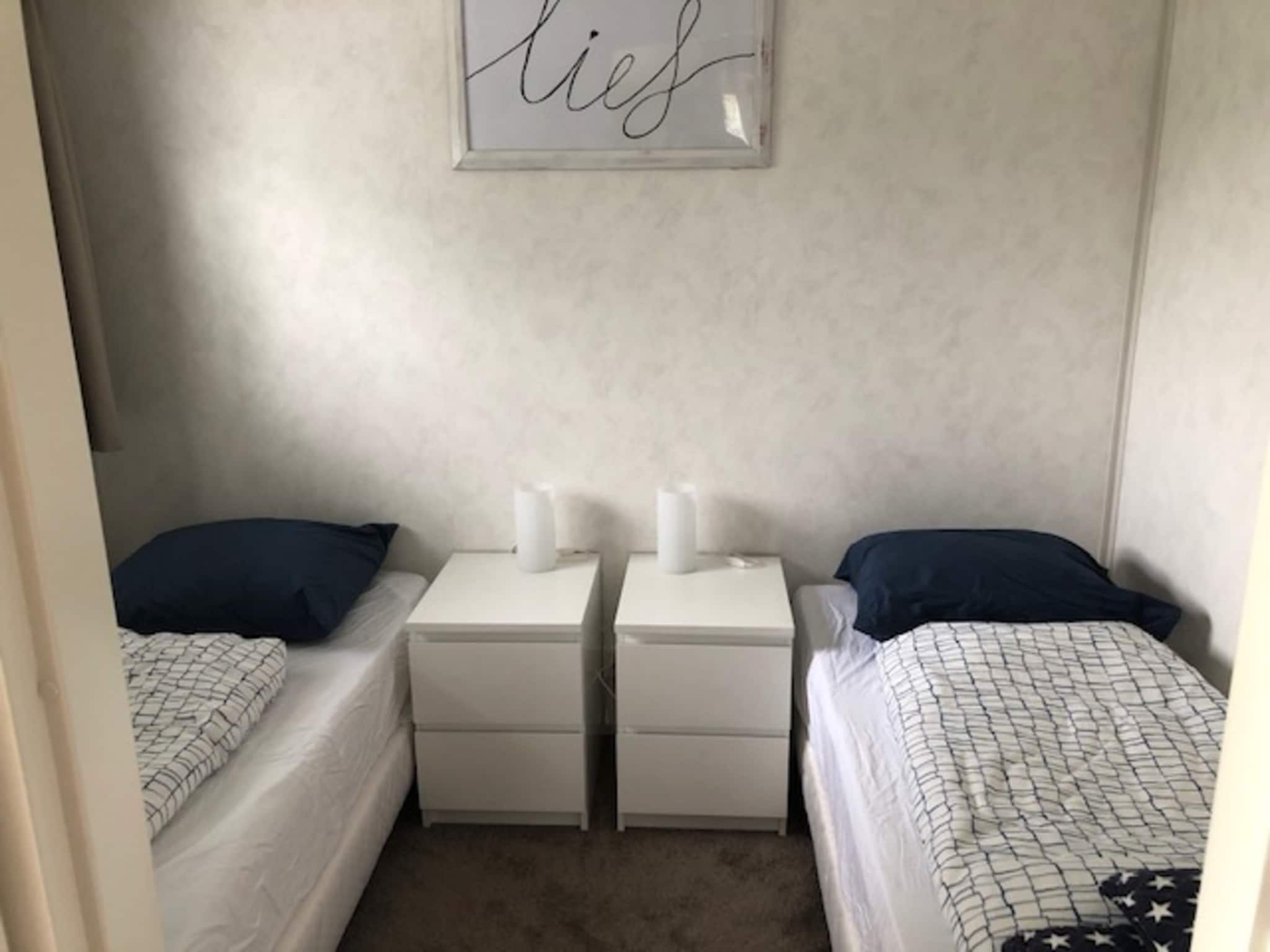 Een slaapkamer van Recreatiepark Wiringherlant - Wiringher Chalet 94 in Hippolytushoef