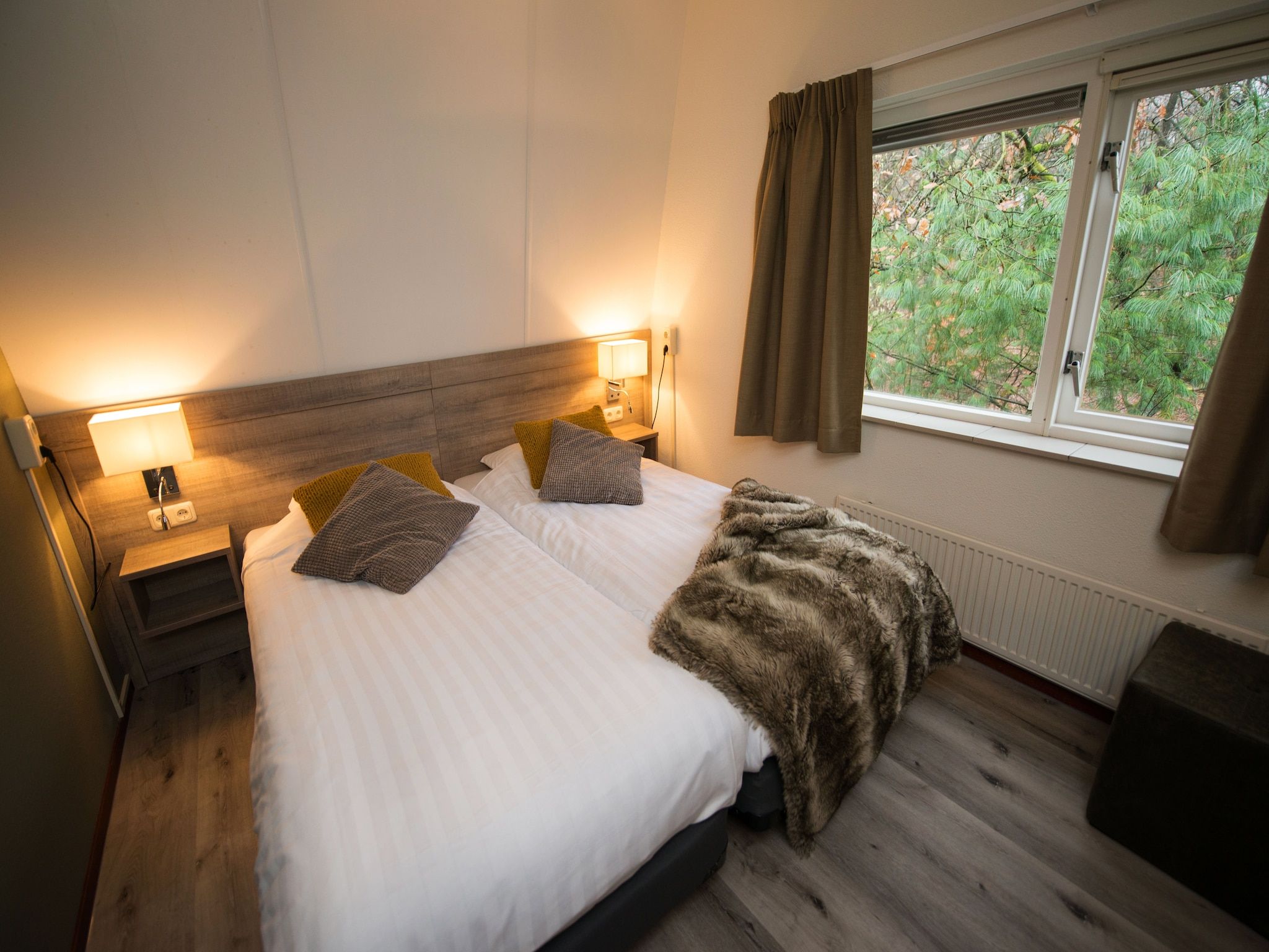 Een slaapkamer van Bungalowpark Hoenderloo 6 in Hoenderloo